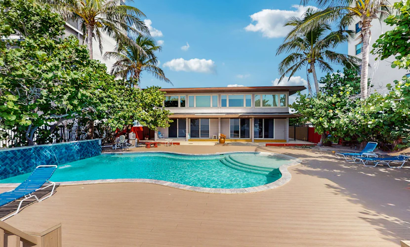 Beachfront condo with pool and island vibes