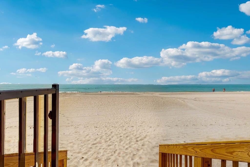 Beachfront condo with pool and island vibes