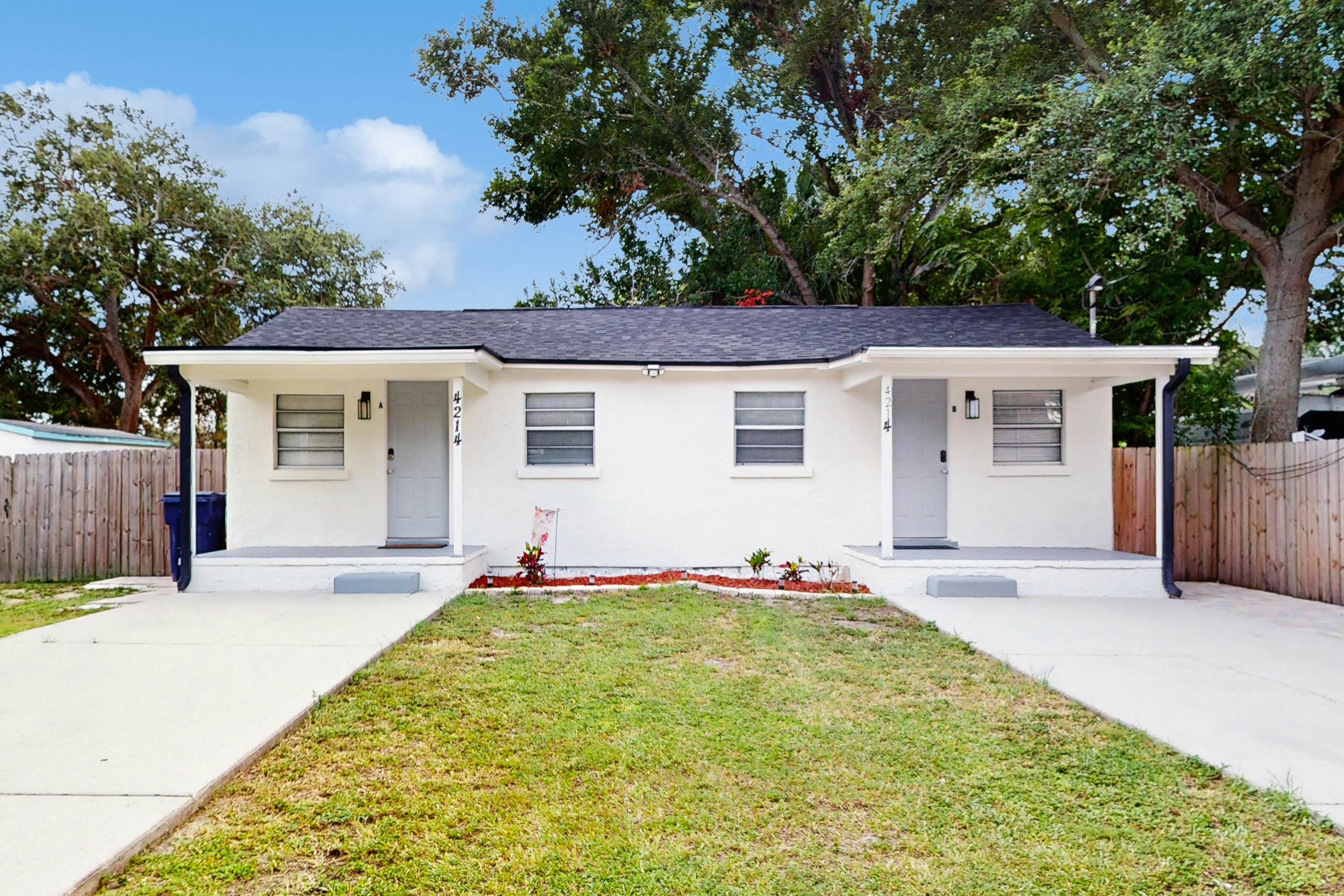 Centrally located comfortable duplex unit with AC, kitchen, with enclosed yard