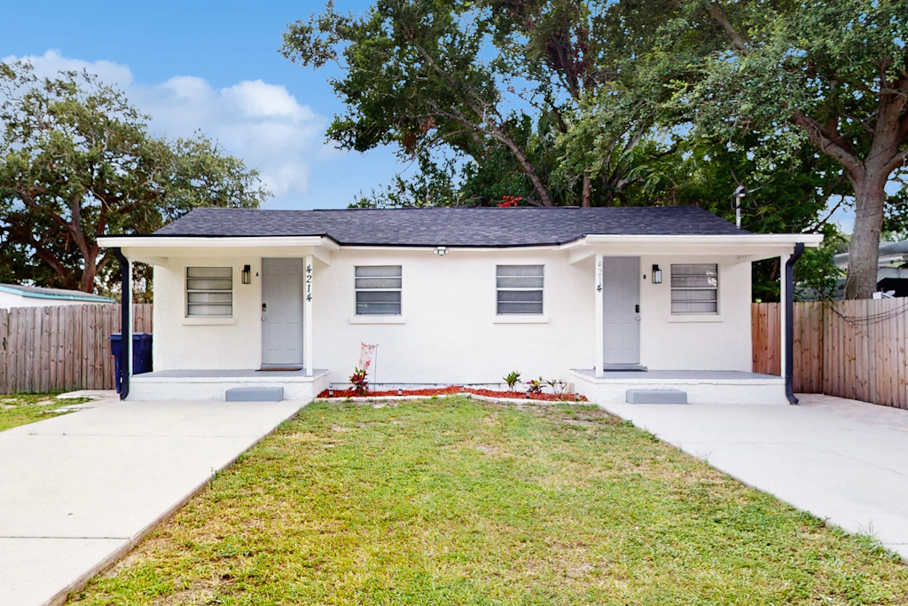 Centrally located comfortable duplex unit with AC kitchen with enclosed yard