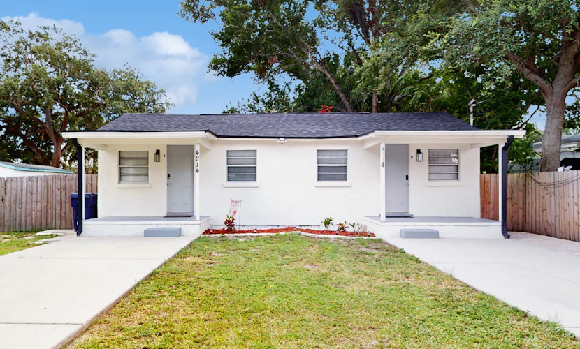 Centrally located comfortable duplex unit with AC kitchen with enclosed yard