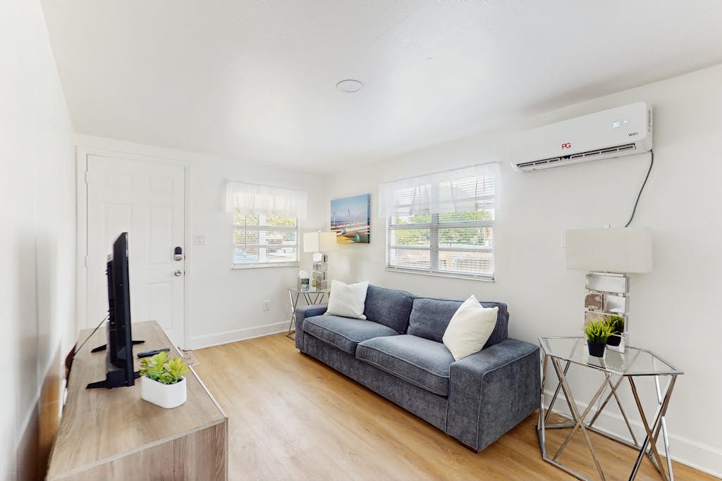 Centrally located comfortable duplex unit with AC kitchen with enclosed yard