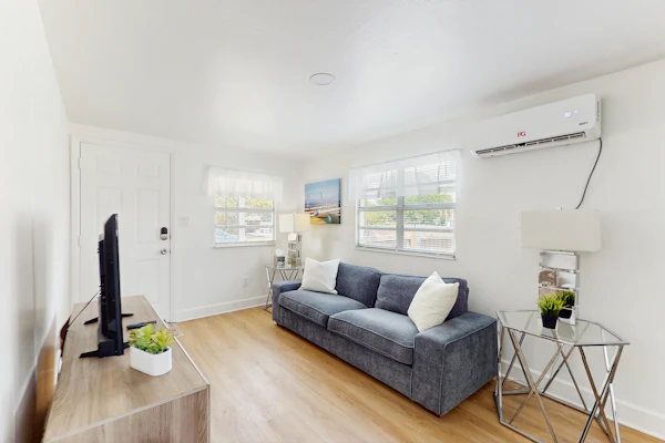 Centrally located comfortable duplex unit with AC kitchen with enclosed yard