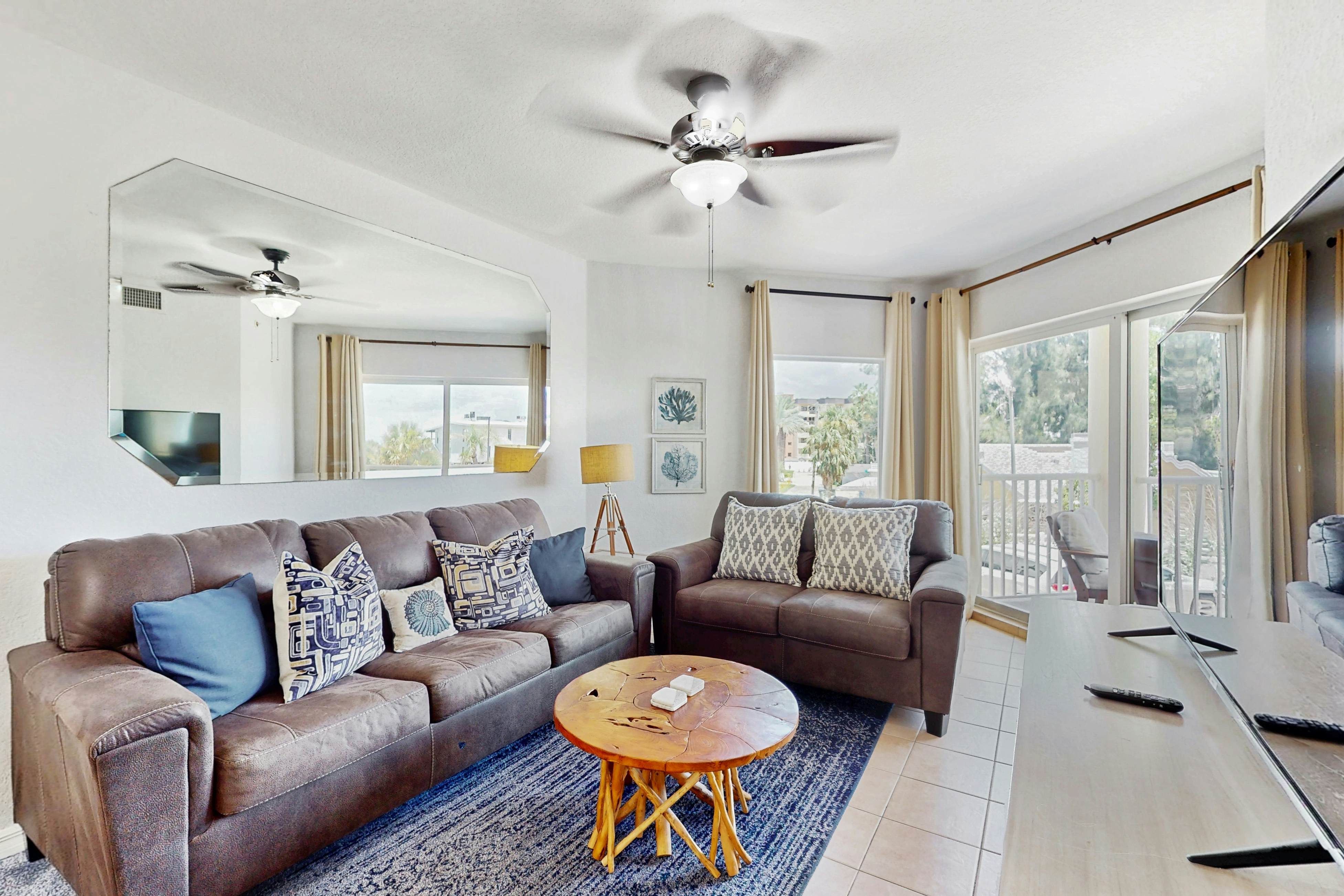 Second-floor condo with beach access, balcony, pool, hot tubs, and ping-pong