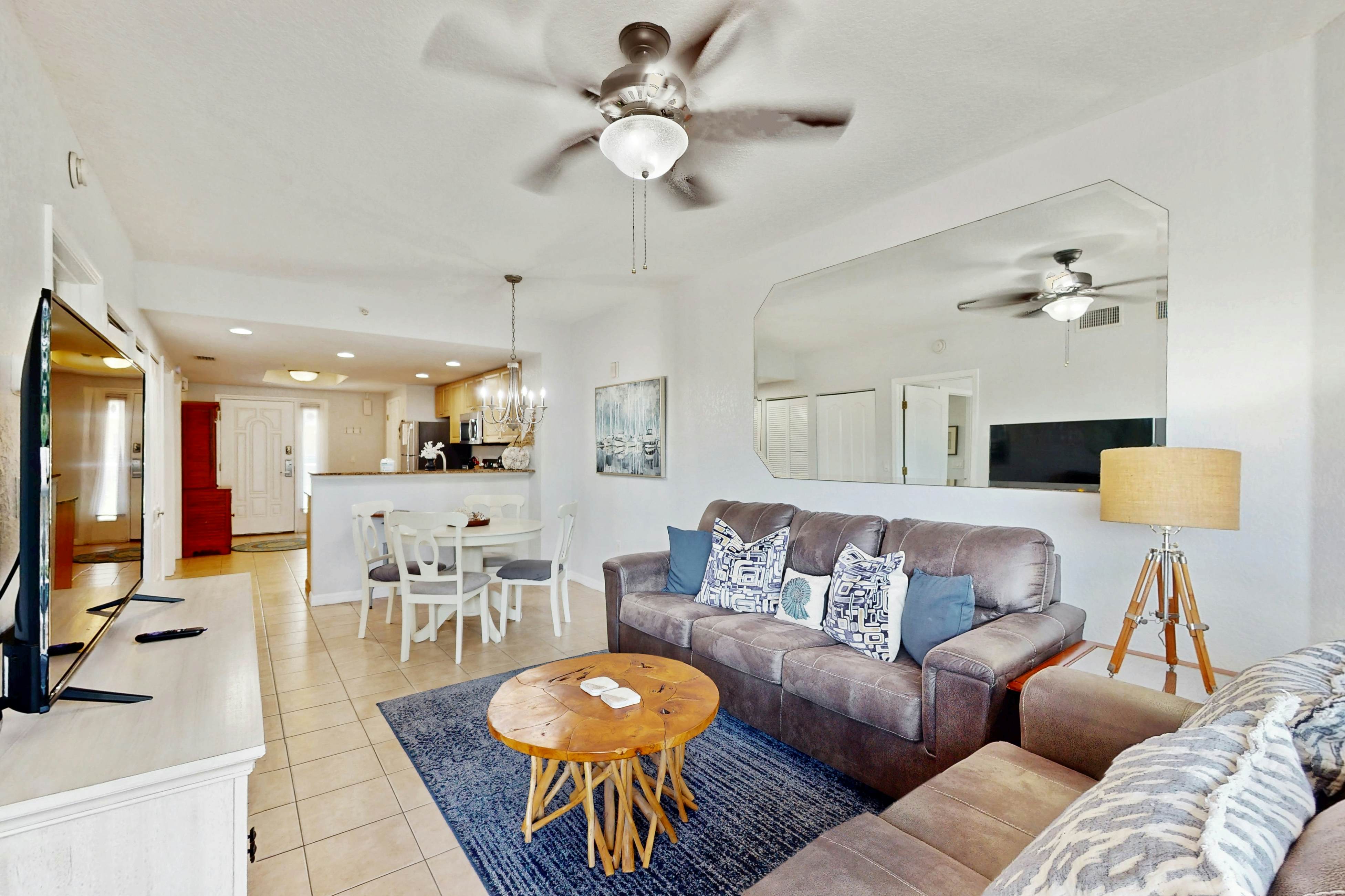 Second-floor condo with beach access, balcony, pool, hot tubs, and ping-pong
