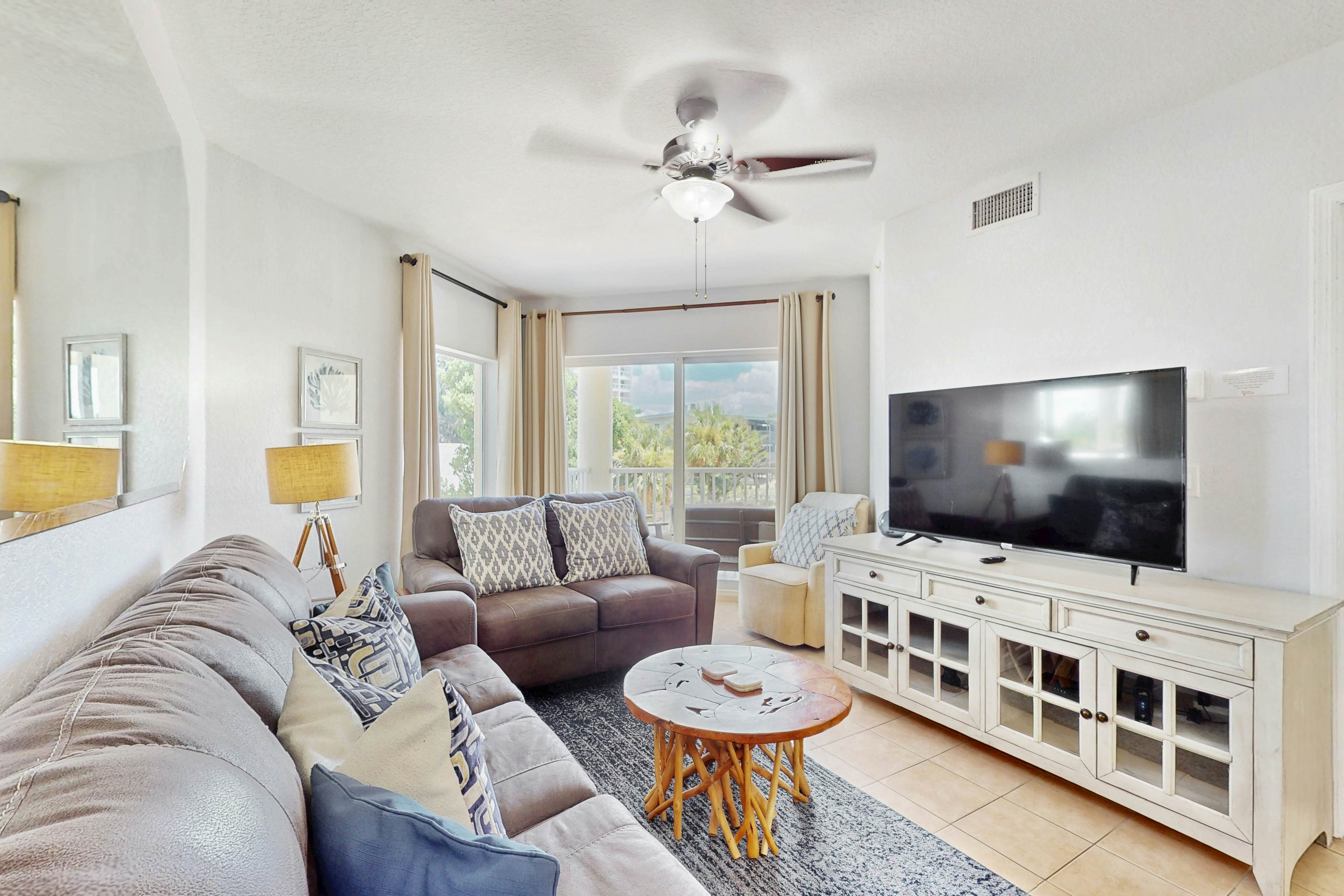 Second-floor condo with beach access, balcony, pool, hot tubs, and ping-pong