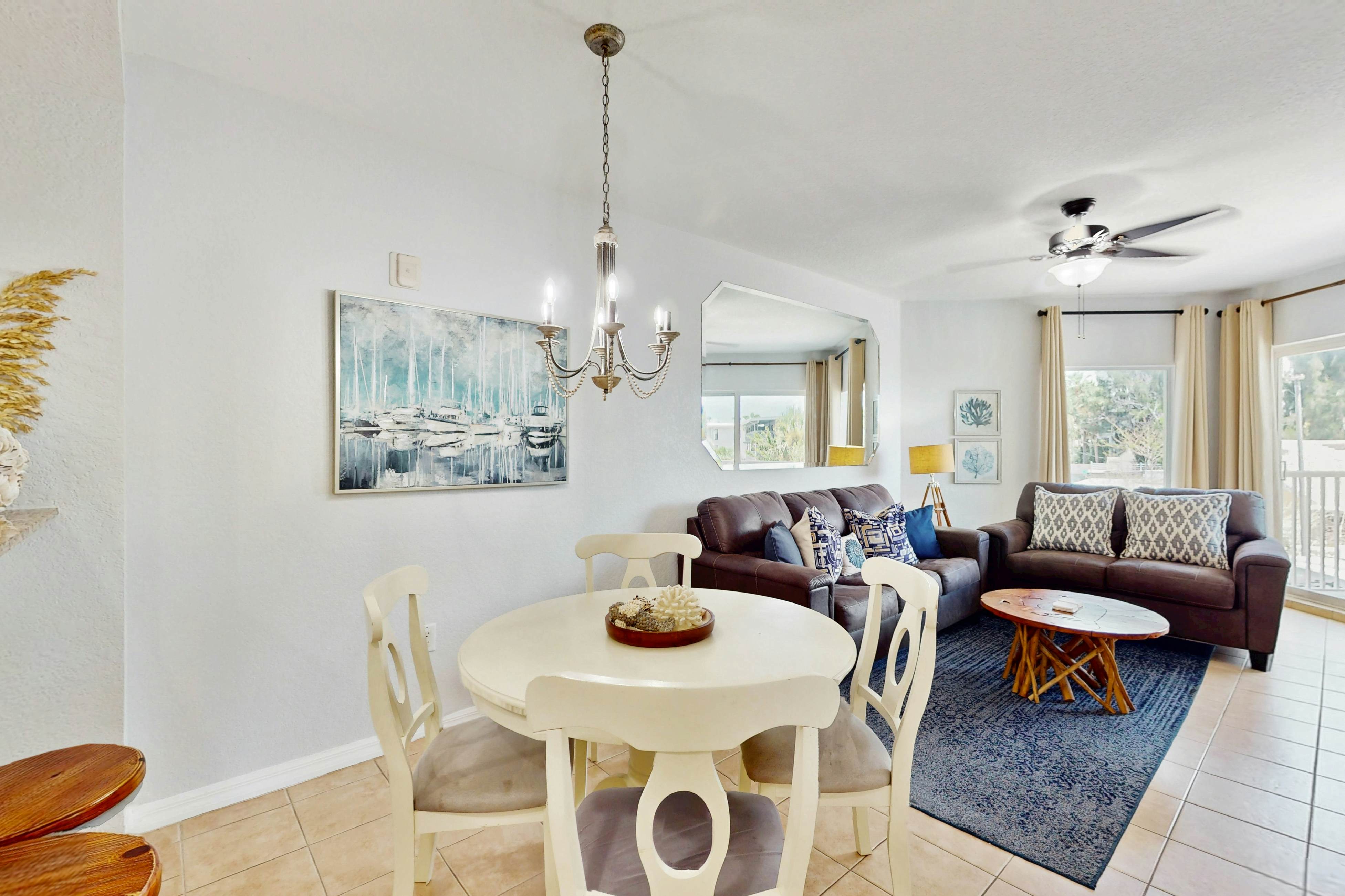 Second-floor condo with beach access, balcony, pool, hot tubs, and ping-pong