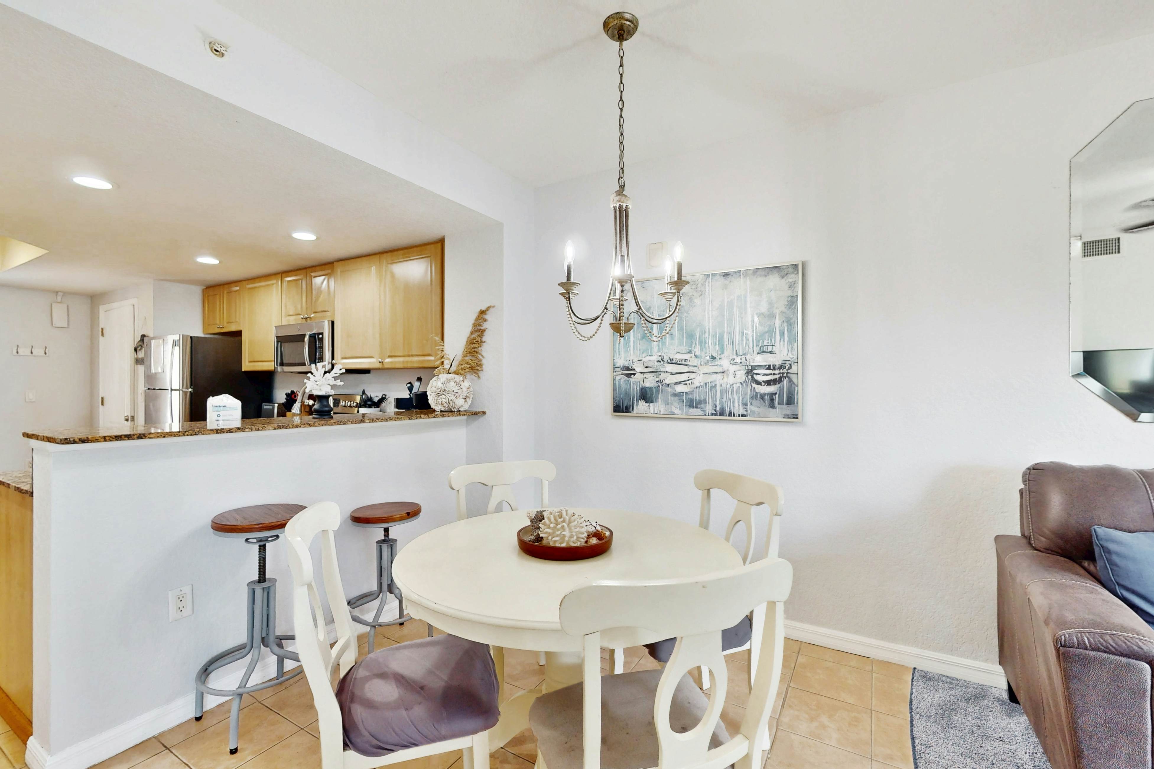 Second-floor condo with beach access, balcony, pool, hot tubs, and ping-pong