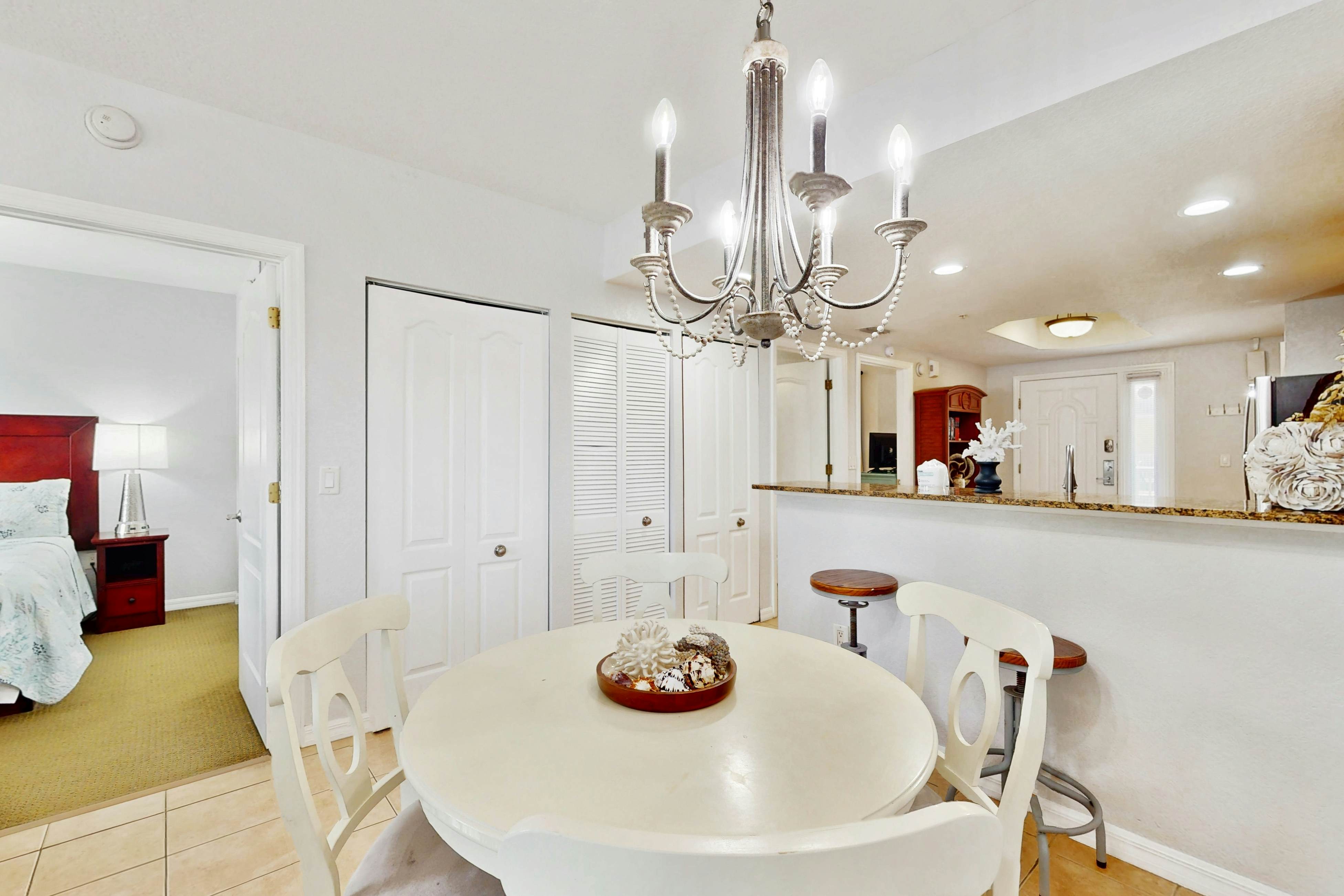 Second-floor condo with beach access, balcony, pool, hot tubs, and ping-pong