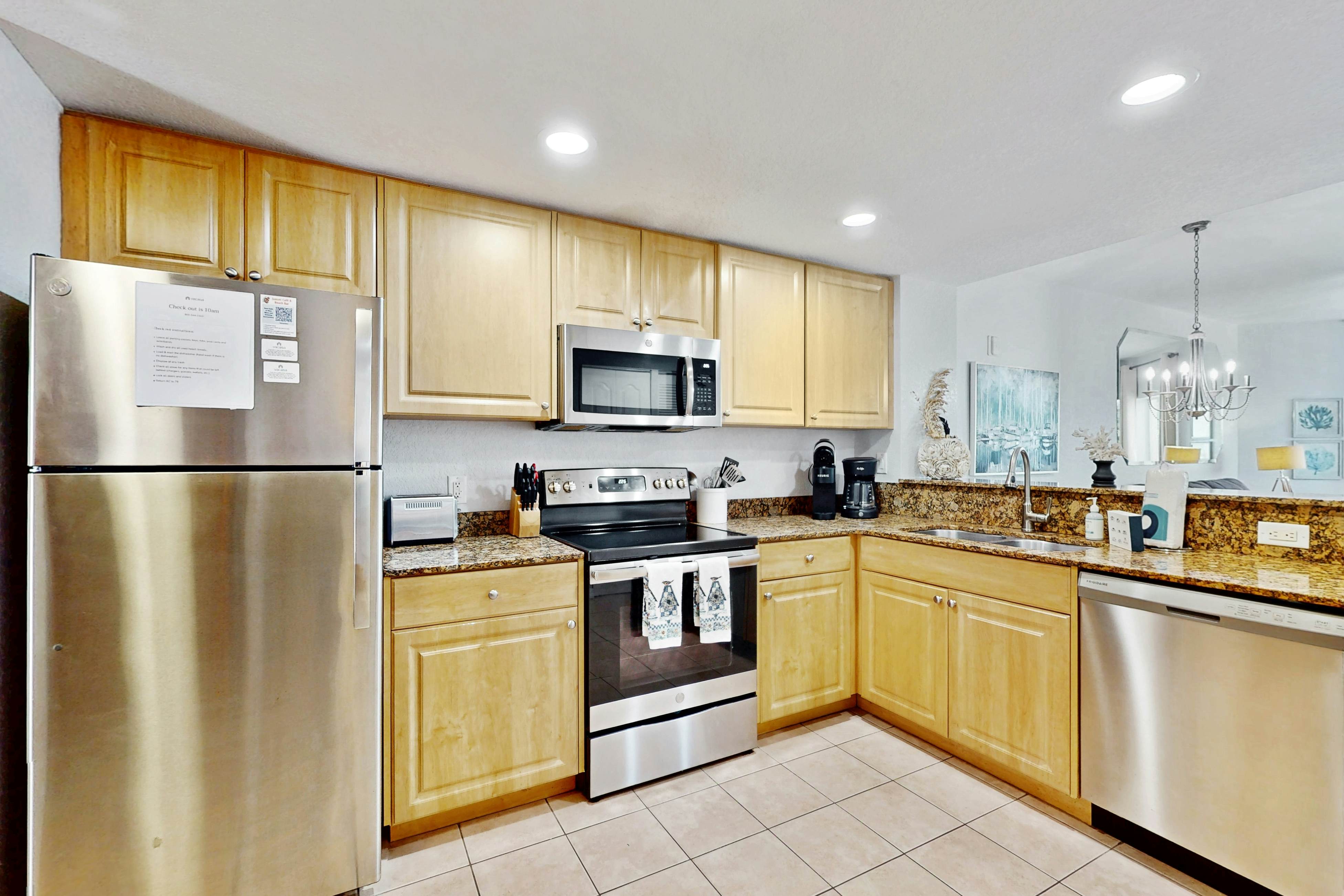 Second-floor condo with beach access, balcony, pool, hot tubs, and ping-pong