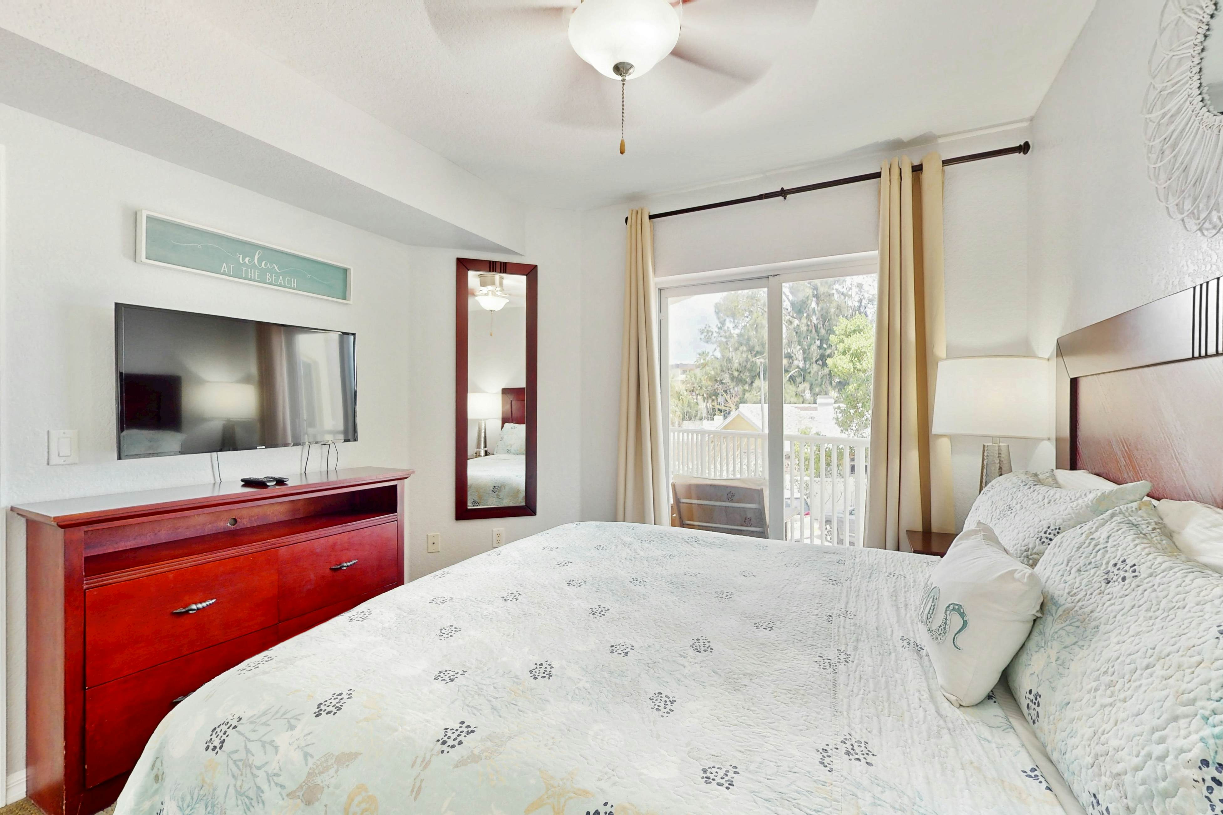 Second-floor condo with beach access, balcony, pool, hot tubs, and ping-pong