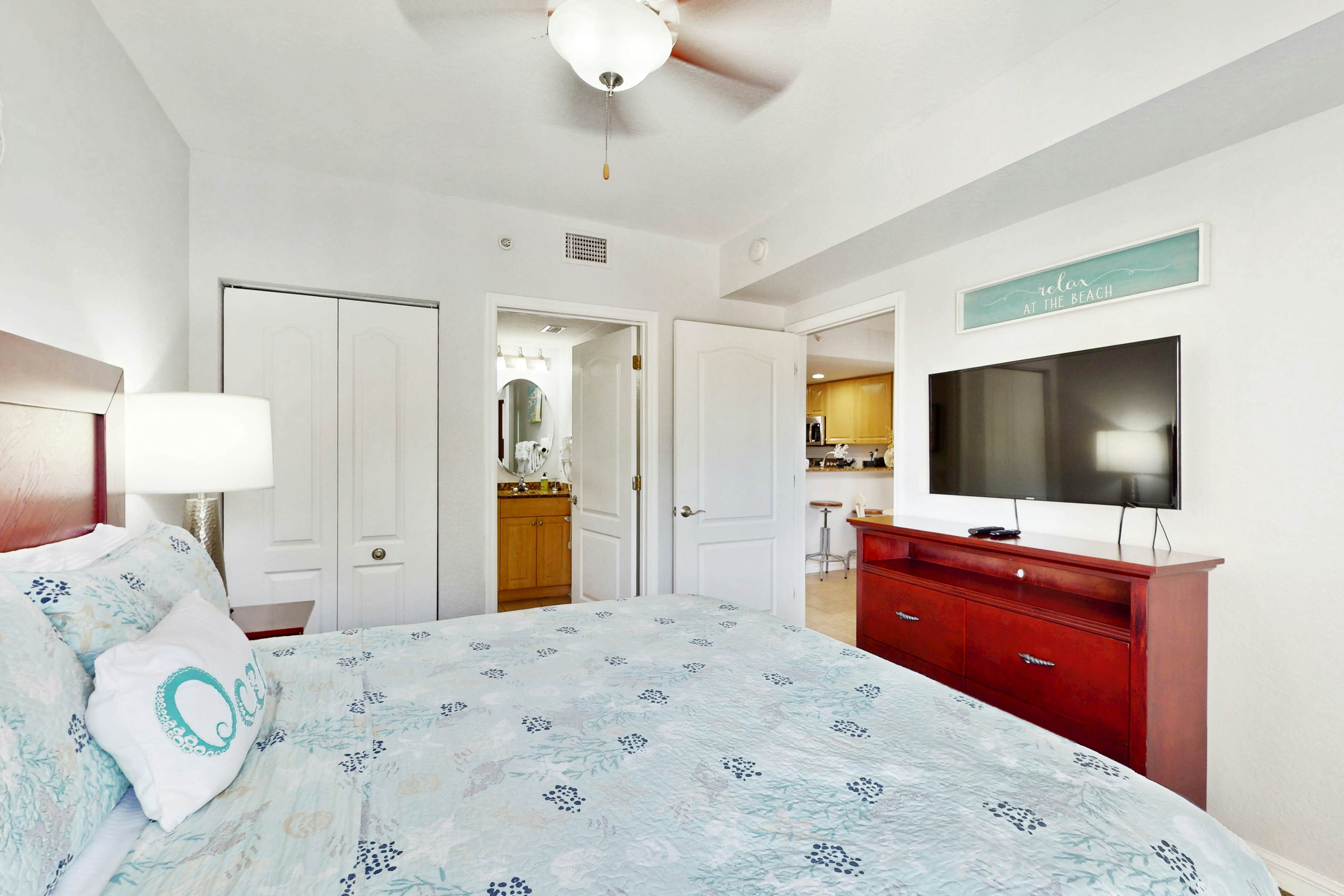 Second-floor condo with beach access, balcony, pool, hot tubs, and ping-pong