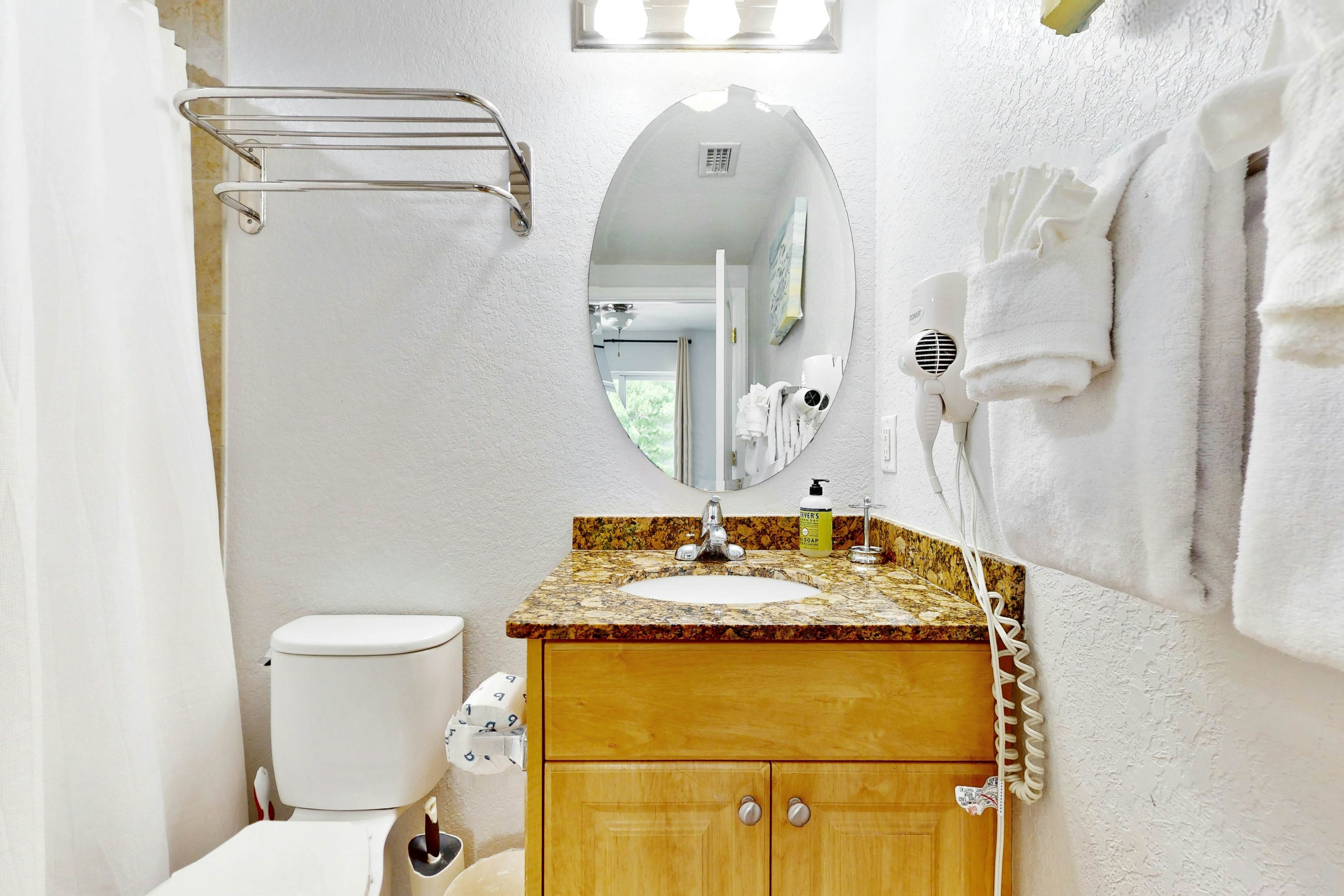 Second-floor condo with beach access, balcony, pool, hot tubs, and ping-pong