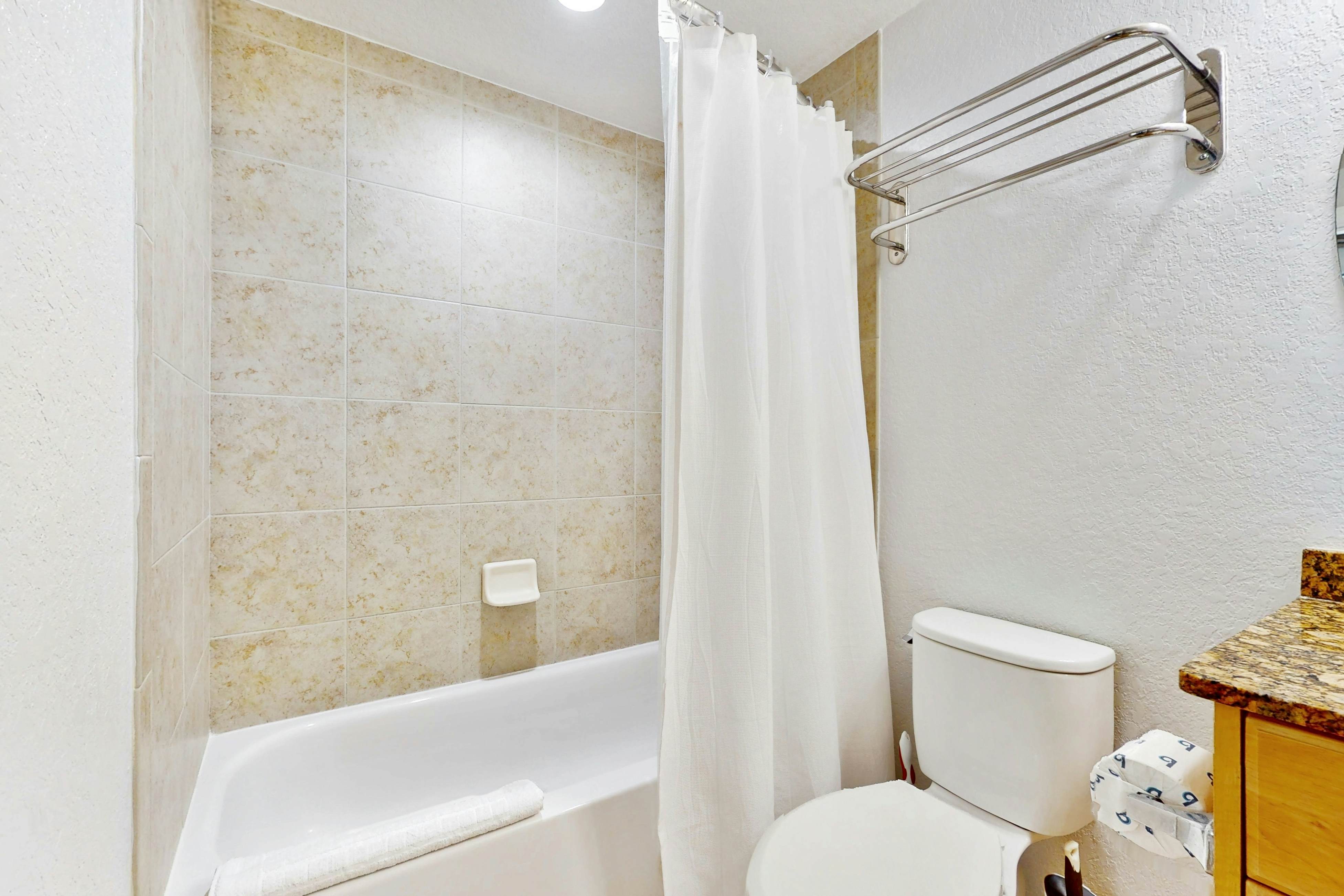 Second-floor condo with beach access, balcony, pool, hot tubs, and ping-pong