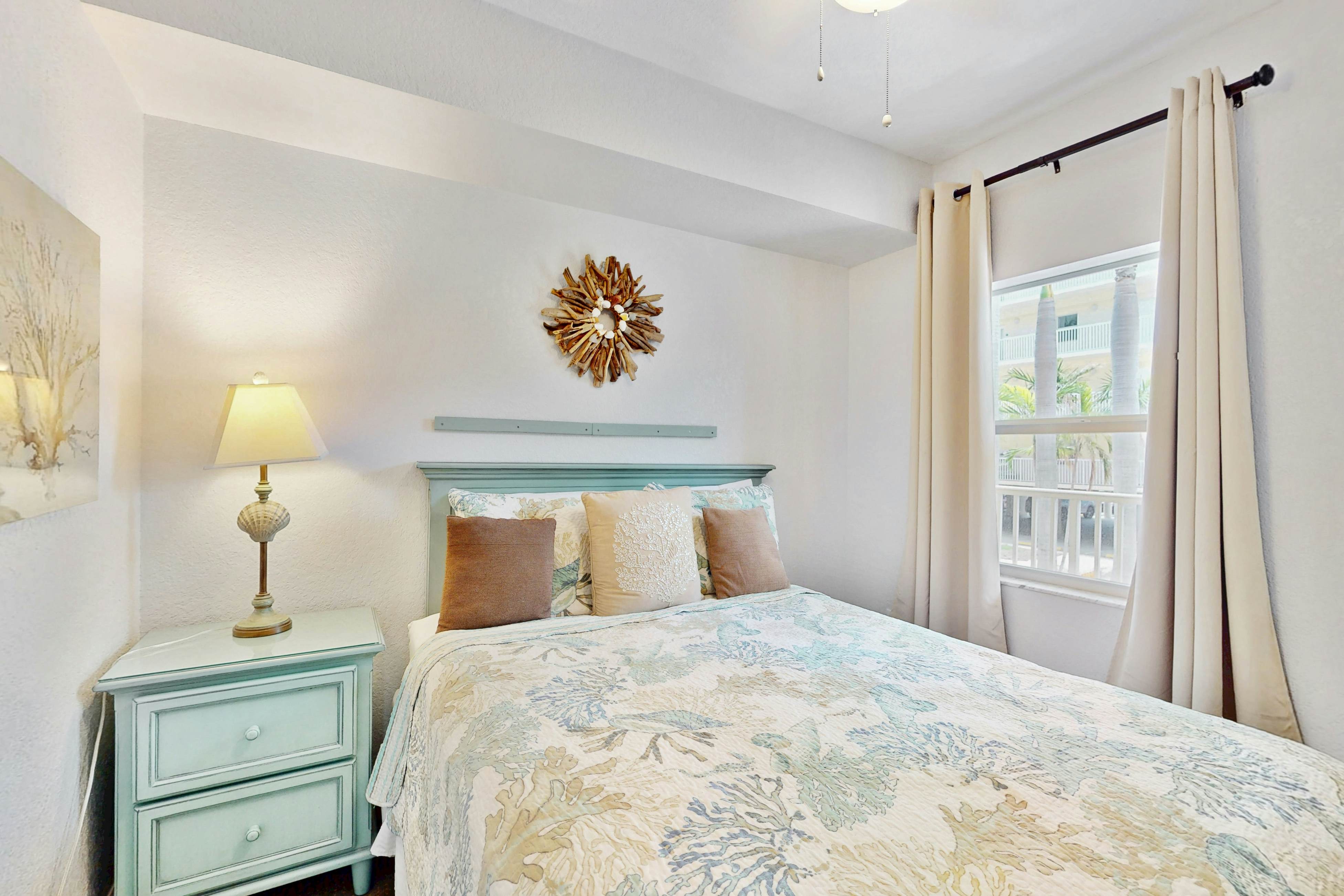 Second-floor condo with beach access, balcony, pool, hot tubs, and ping-pong