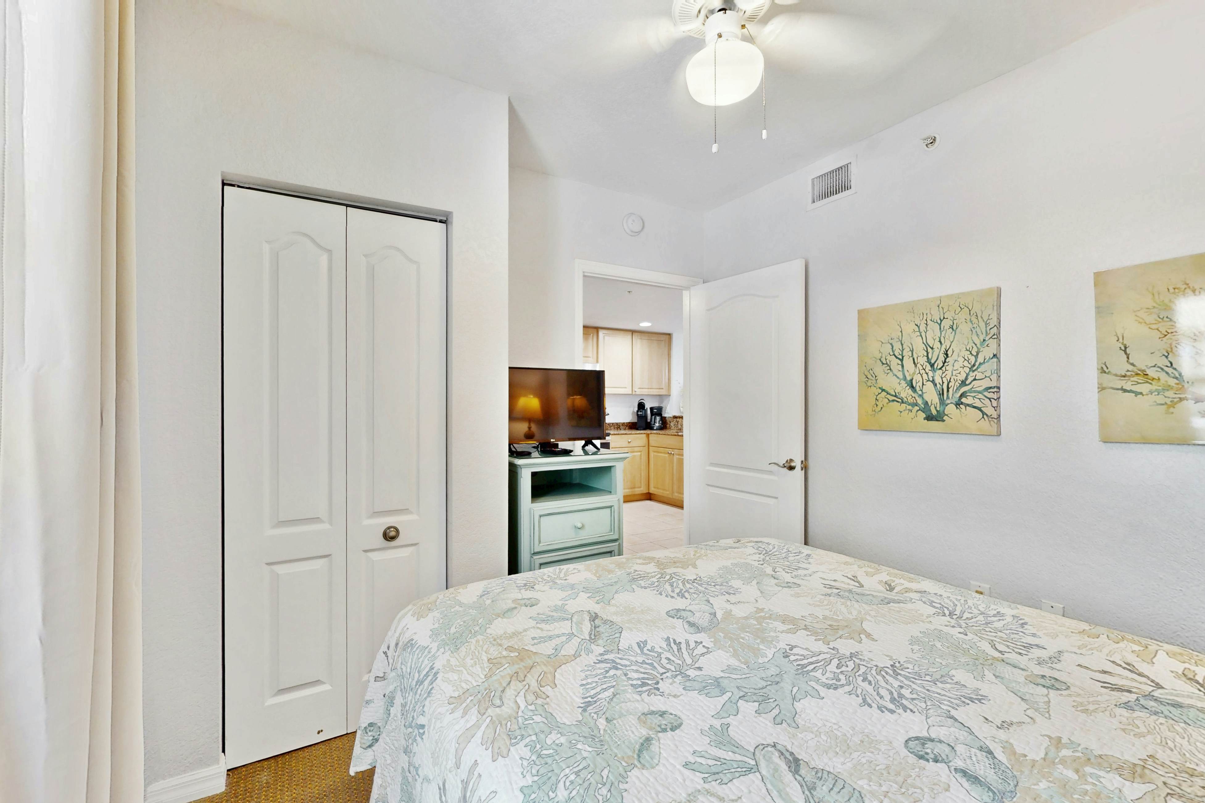 Second-floor condo with beach access, balcony, pool, hot tubs, and ping-pong