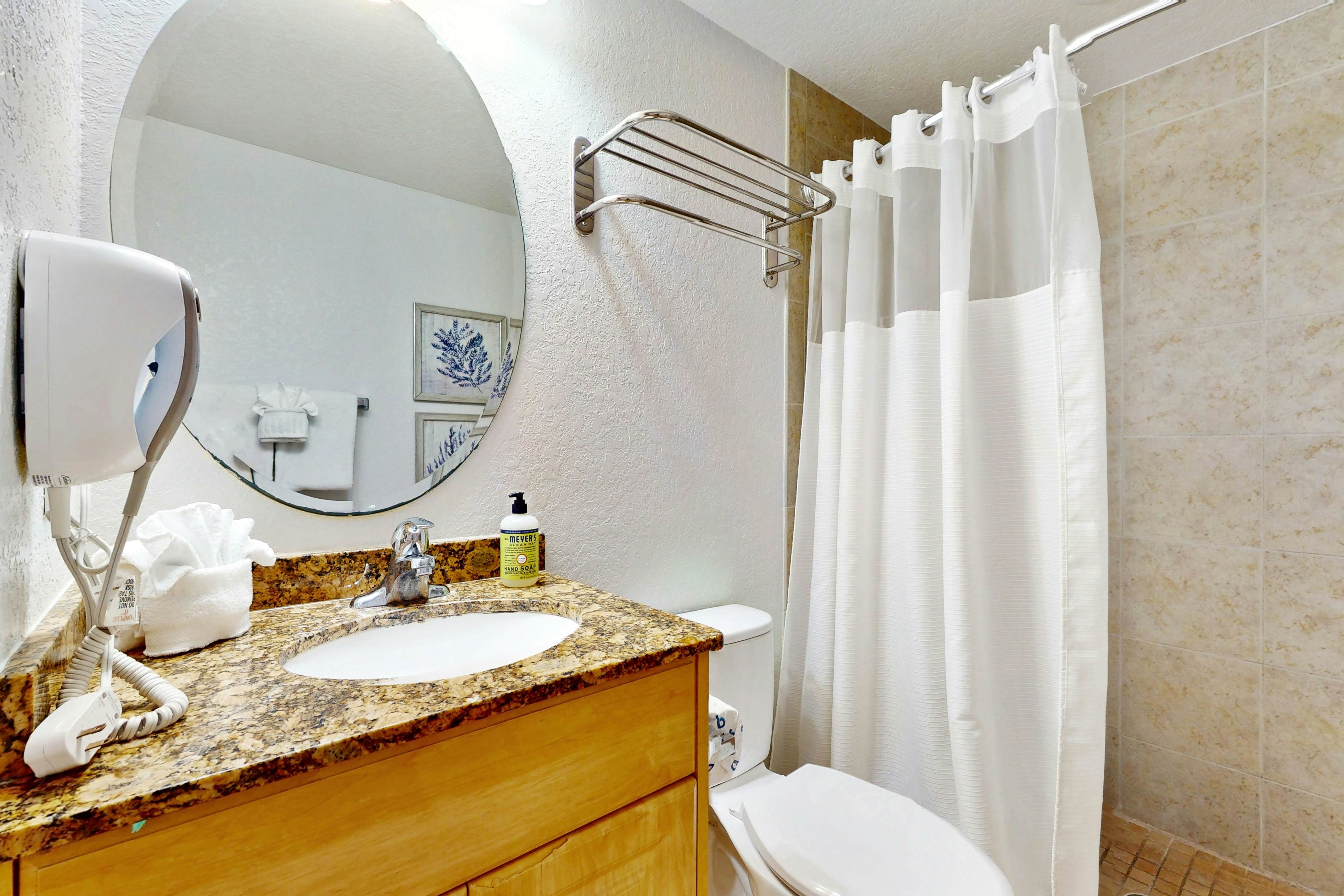 Second-floor condo with beach access, balcony, pool, hot tubs, and ping-pong