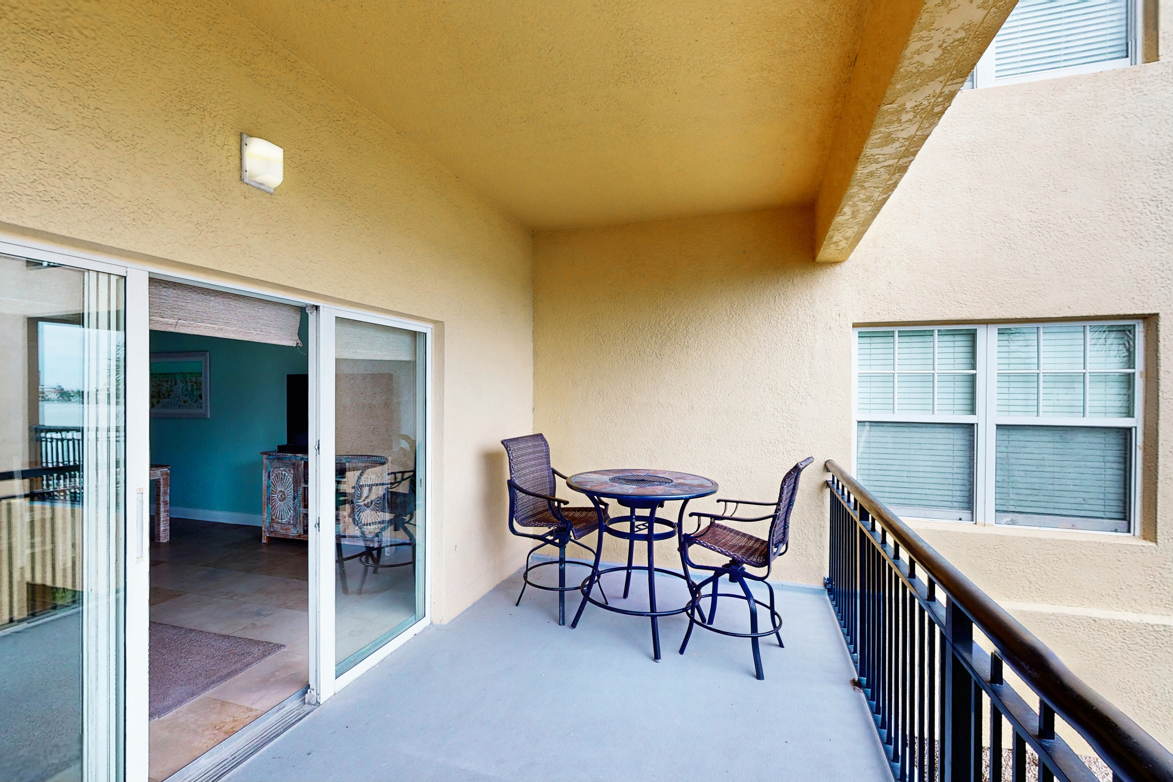 Water view condo with pool hot tub pier private balcony AC and washer dryer