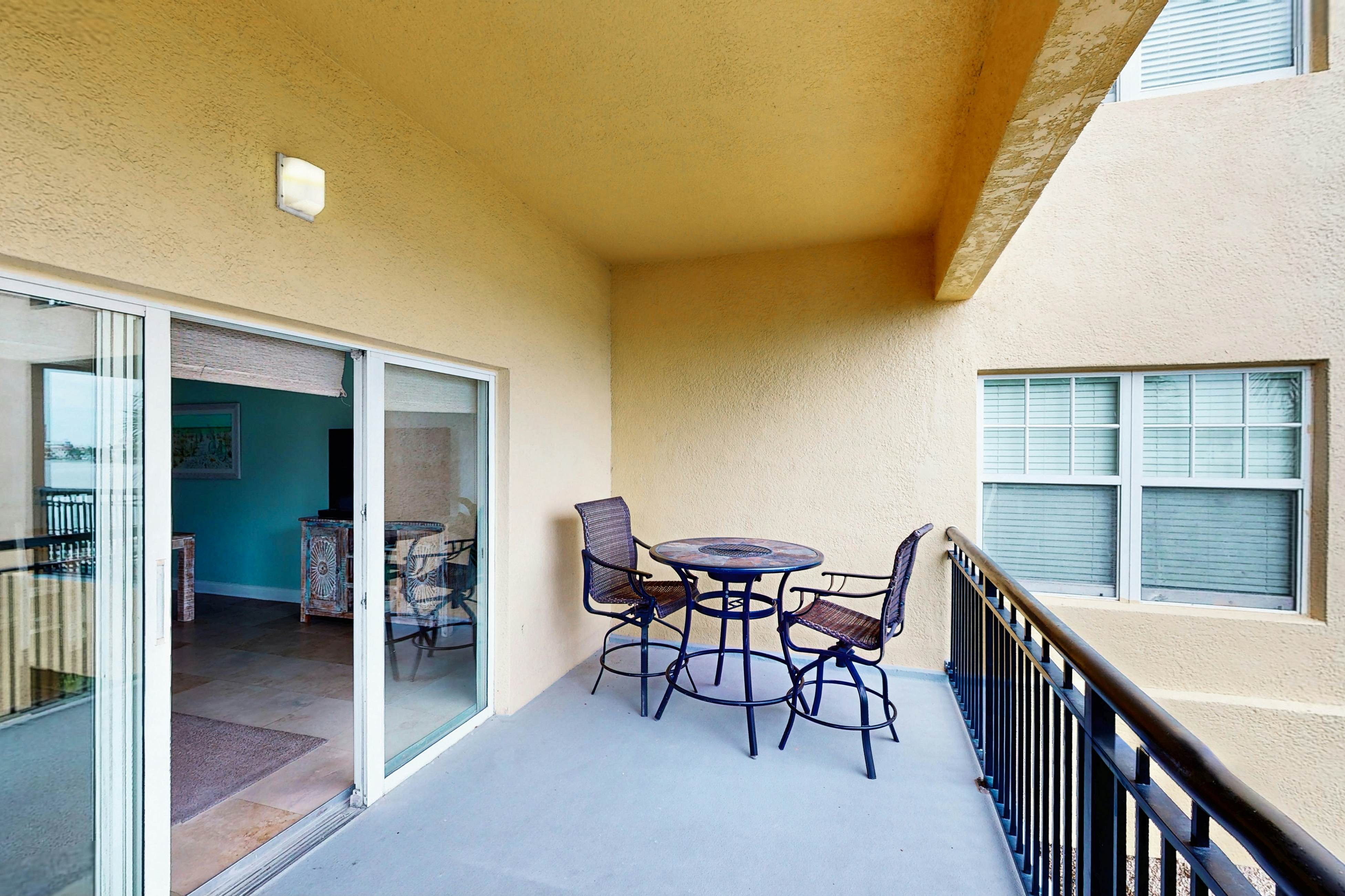 Water-view condo with pool, hot tub, pier, private balcony, AC, & washer/dryer