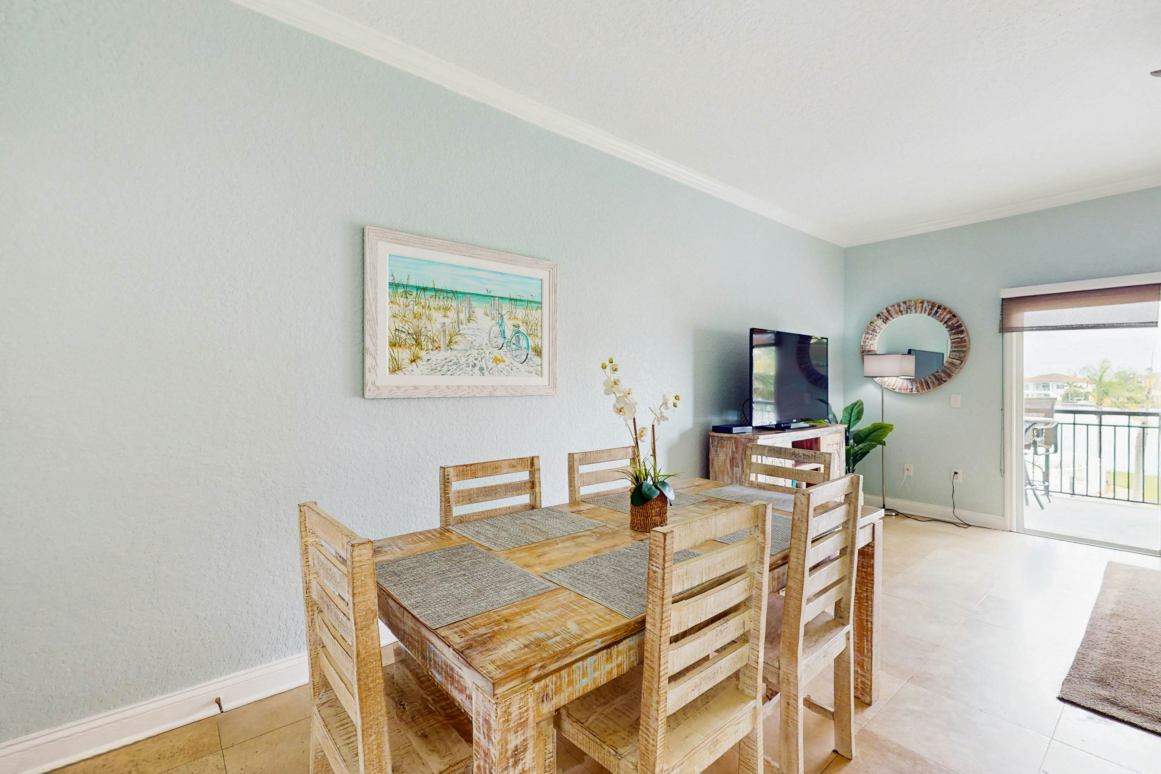 Water-view condo with pool, hot tub, pier, private balcony, AC, & washer/dryer