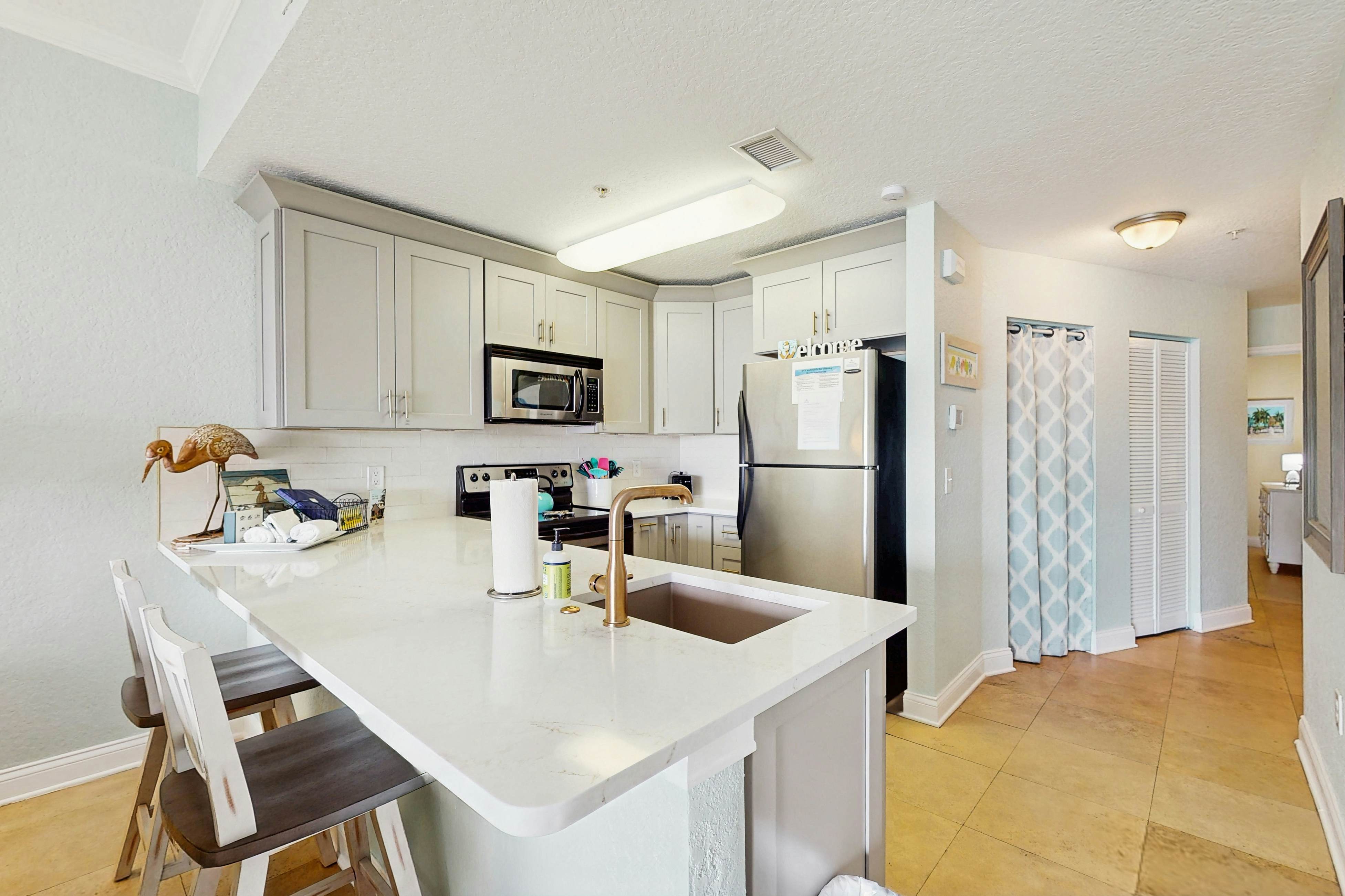 Water-view condo with pool, hot tub, pier, private balcony, AC, & washer/dryer