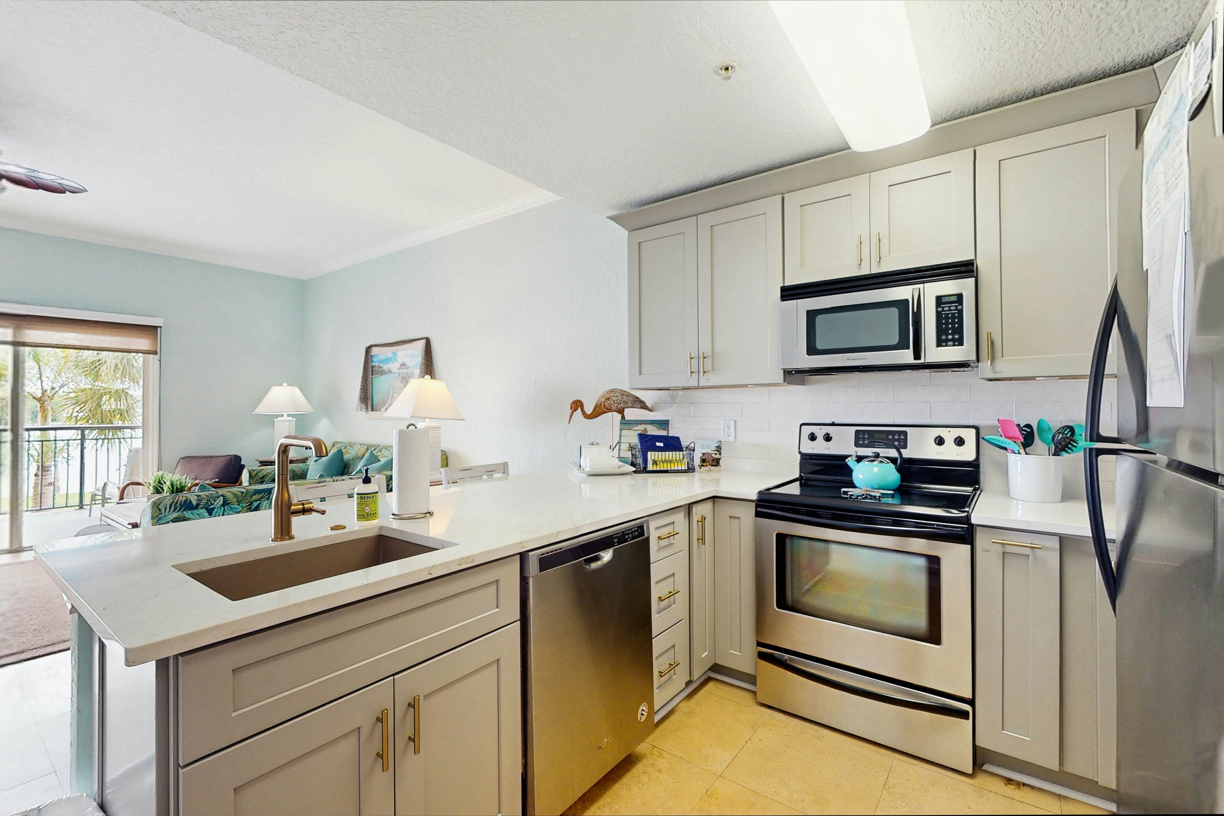 Water-view condo with pool, hot tub, pier, private balcony, AC, & washer/dryer