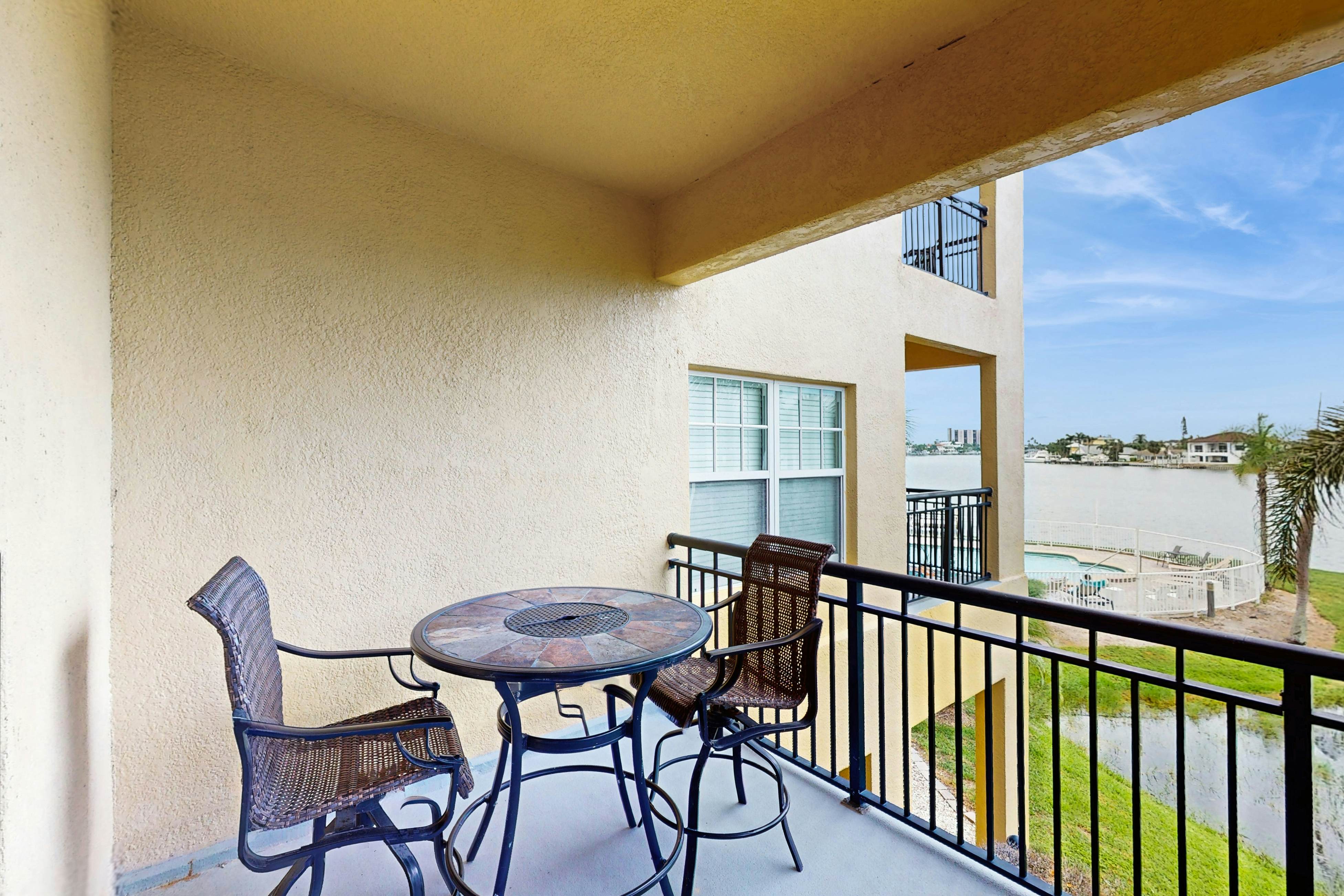 Water-view condo with pool, hot tub, pier, private balcony, AC, & washer/dryer