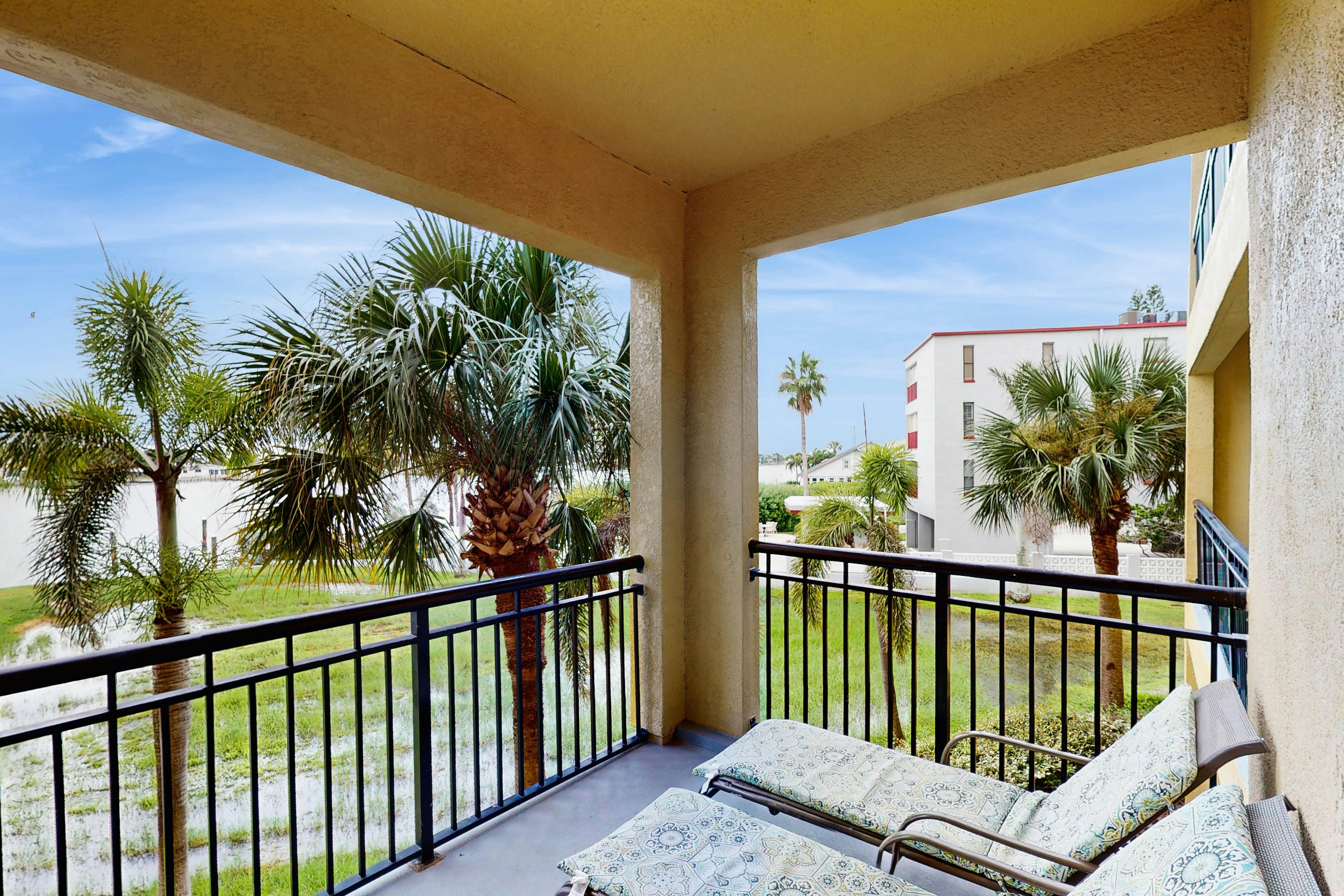 Water-view condo with pool, hot tub, pier, private balcony, AC, & washer/dryer