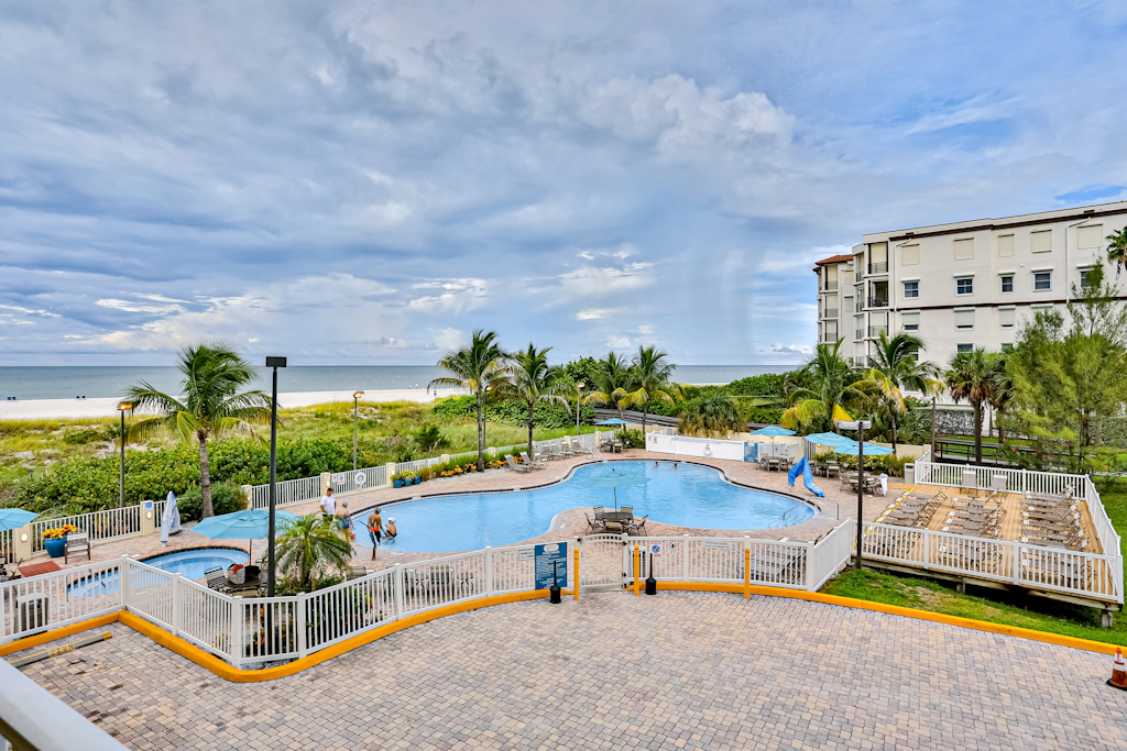 Beachfront and family friendly condo with two pools and hot tub steps to the Gulf