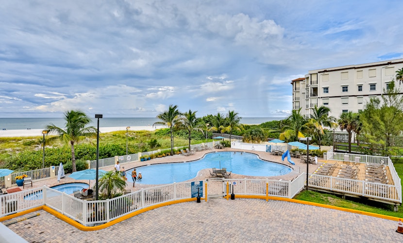 Beachfront and family friendly condo with two pools and hot tub steps to the Gulf