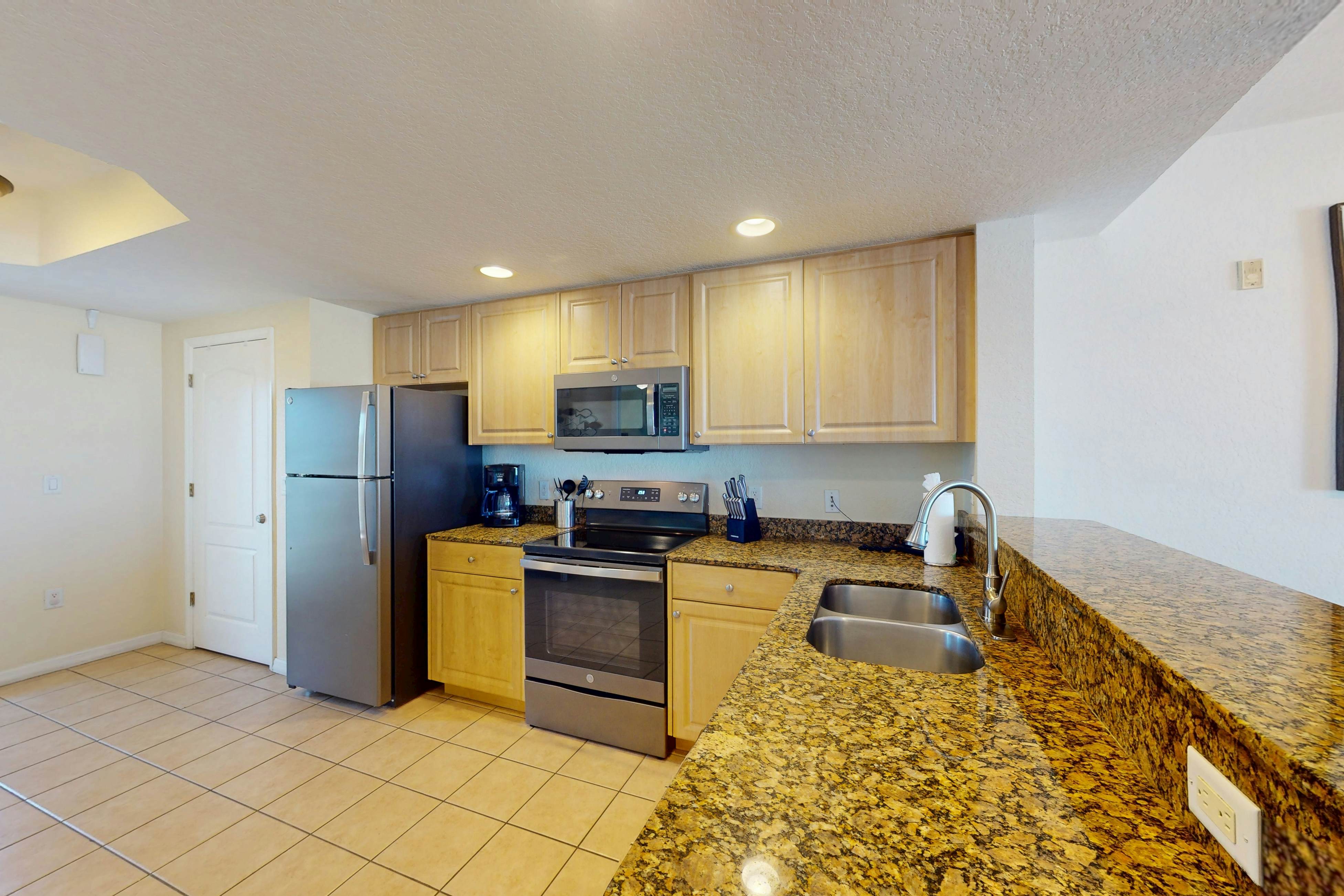 Beachfront and family friendly condo with two pools & hot tub- steps to the Gulf
