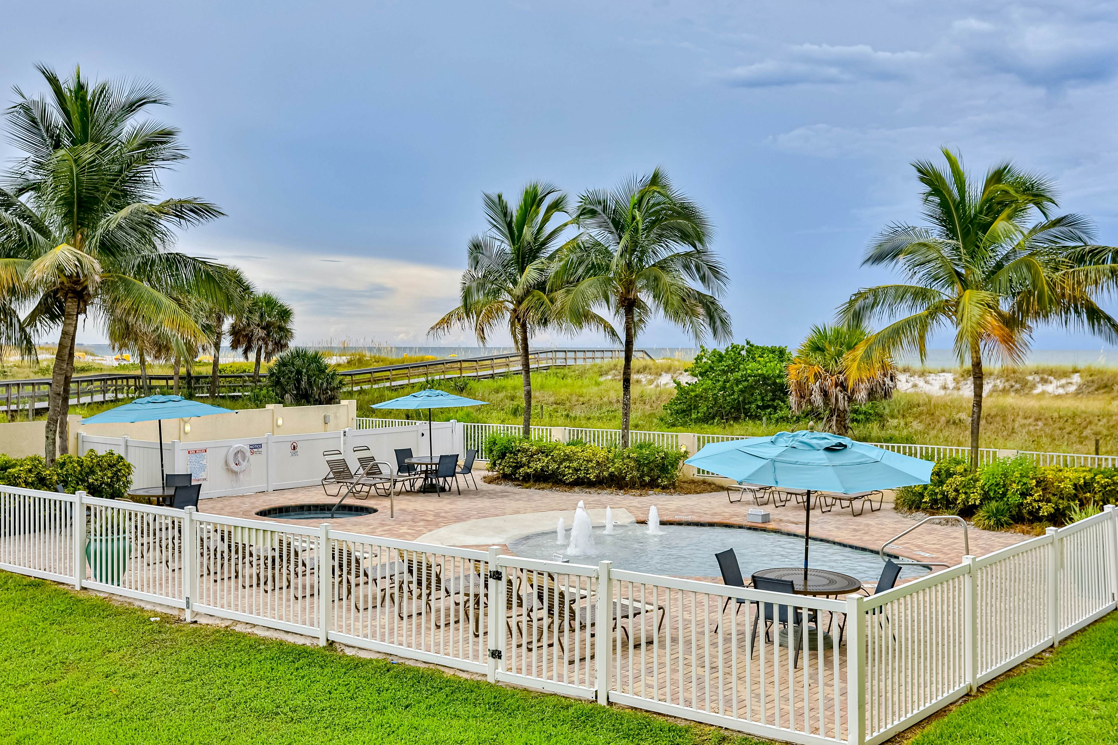 Beachfront and family friendly condo with two pools & hot tub- steps to the Gulf