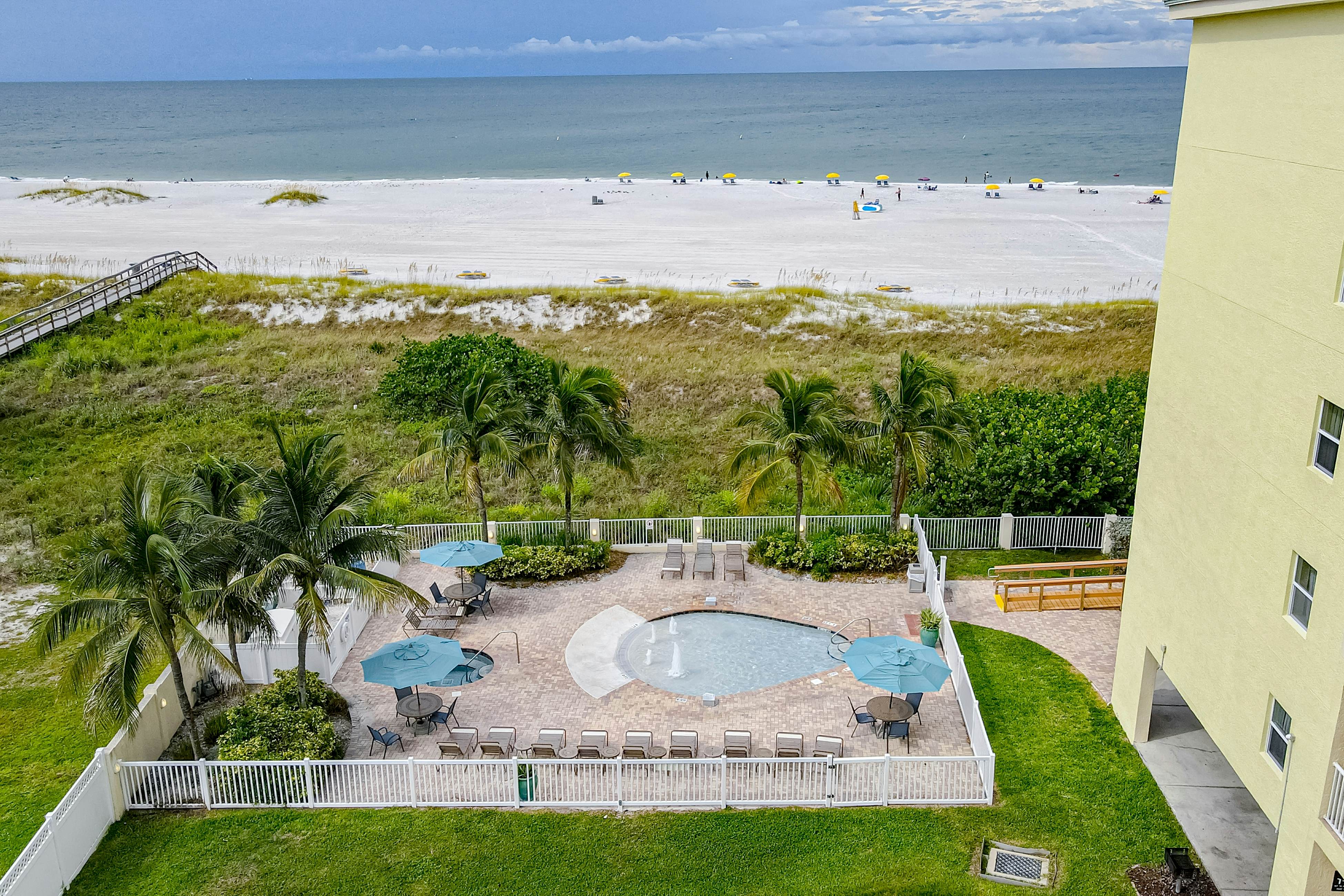 Beachfront and family friendly condo with two pools & hot tub- steps to the Gulf