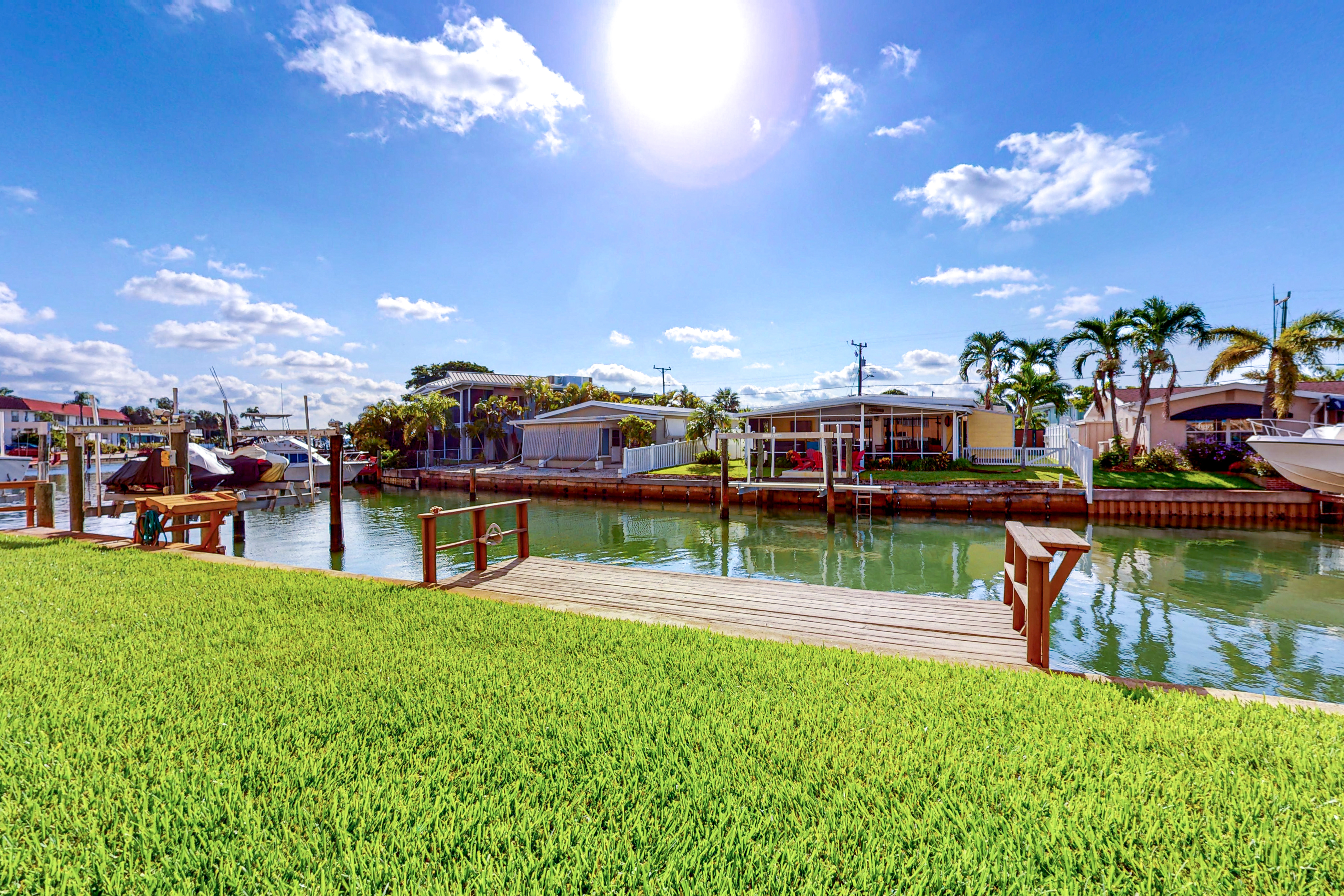 Canal front home near the beach with outdoor pool balcony water views and WD