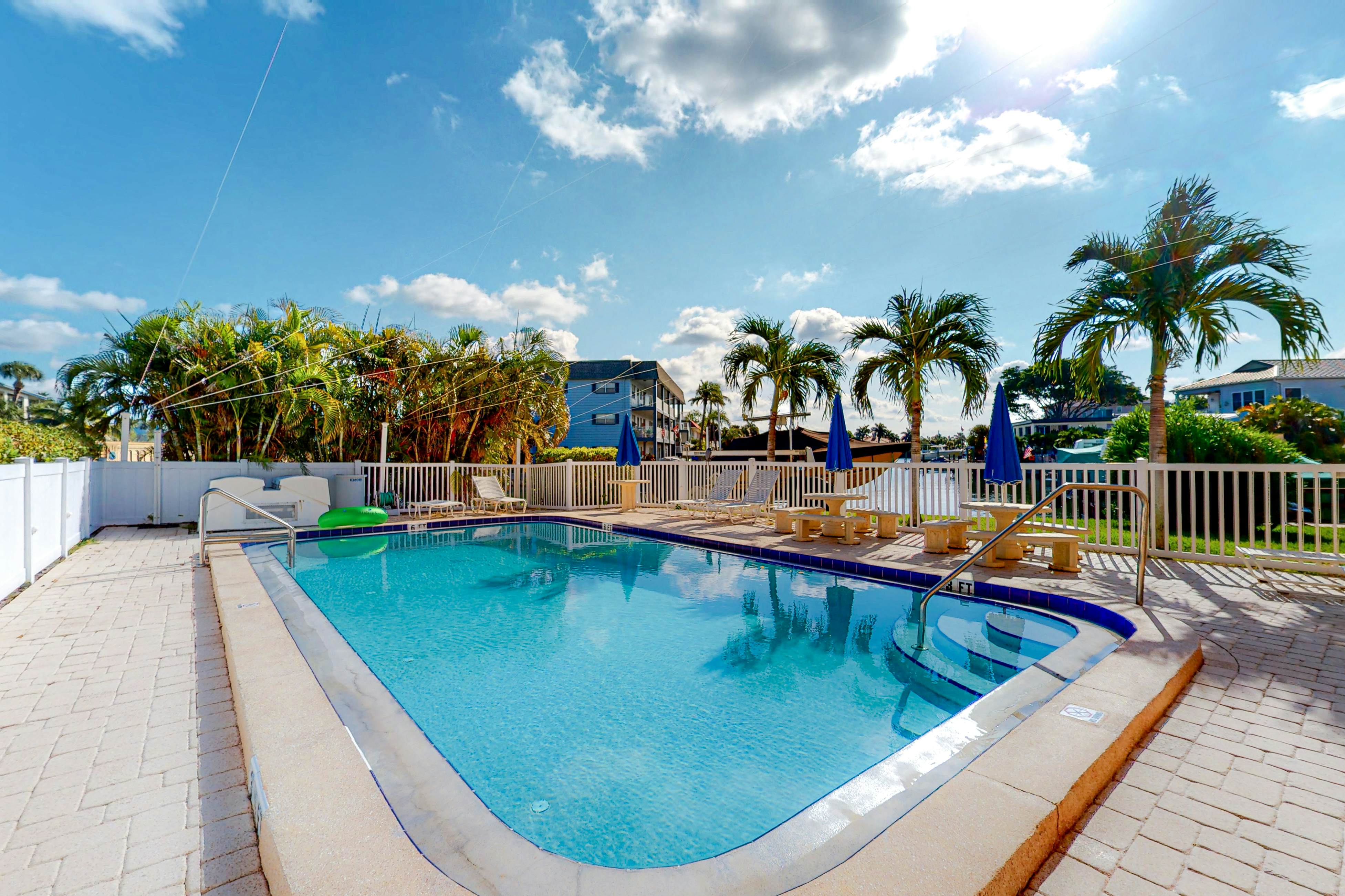 Canal front home near the beach with outdoor pool balcony water views and WD