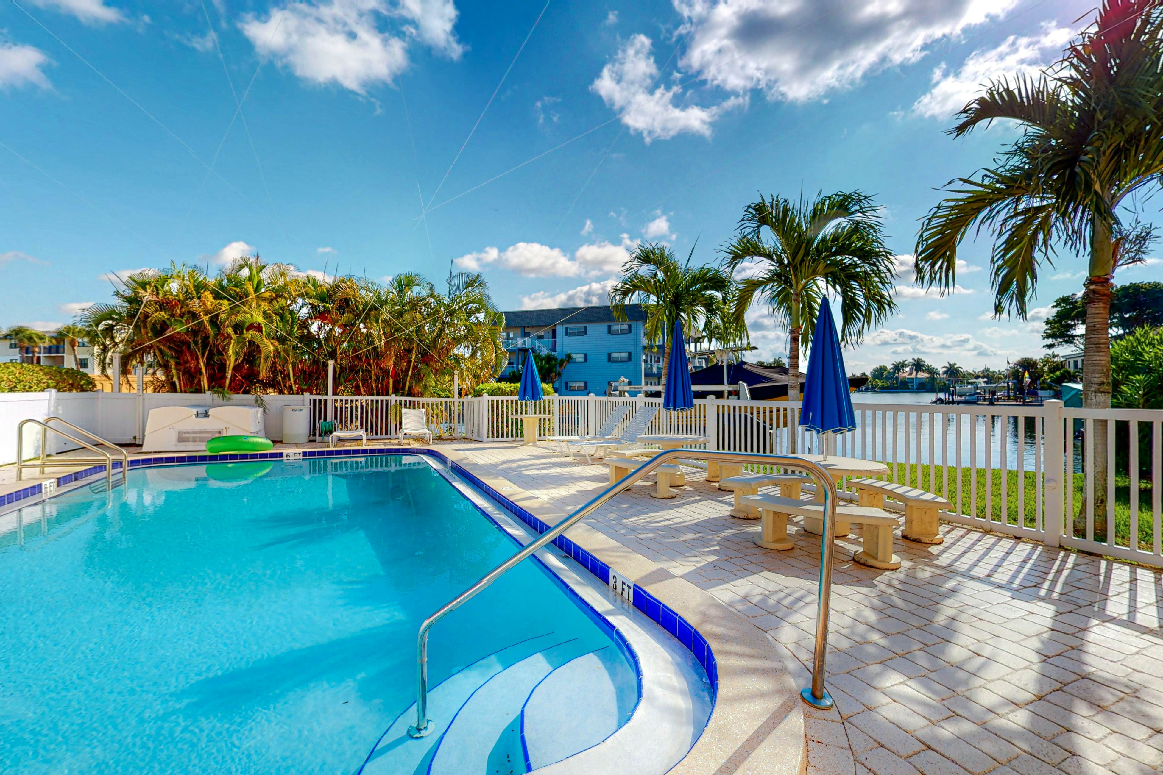 Canal front home near the beach with outdoor pool balcony water views and WD