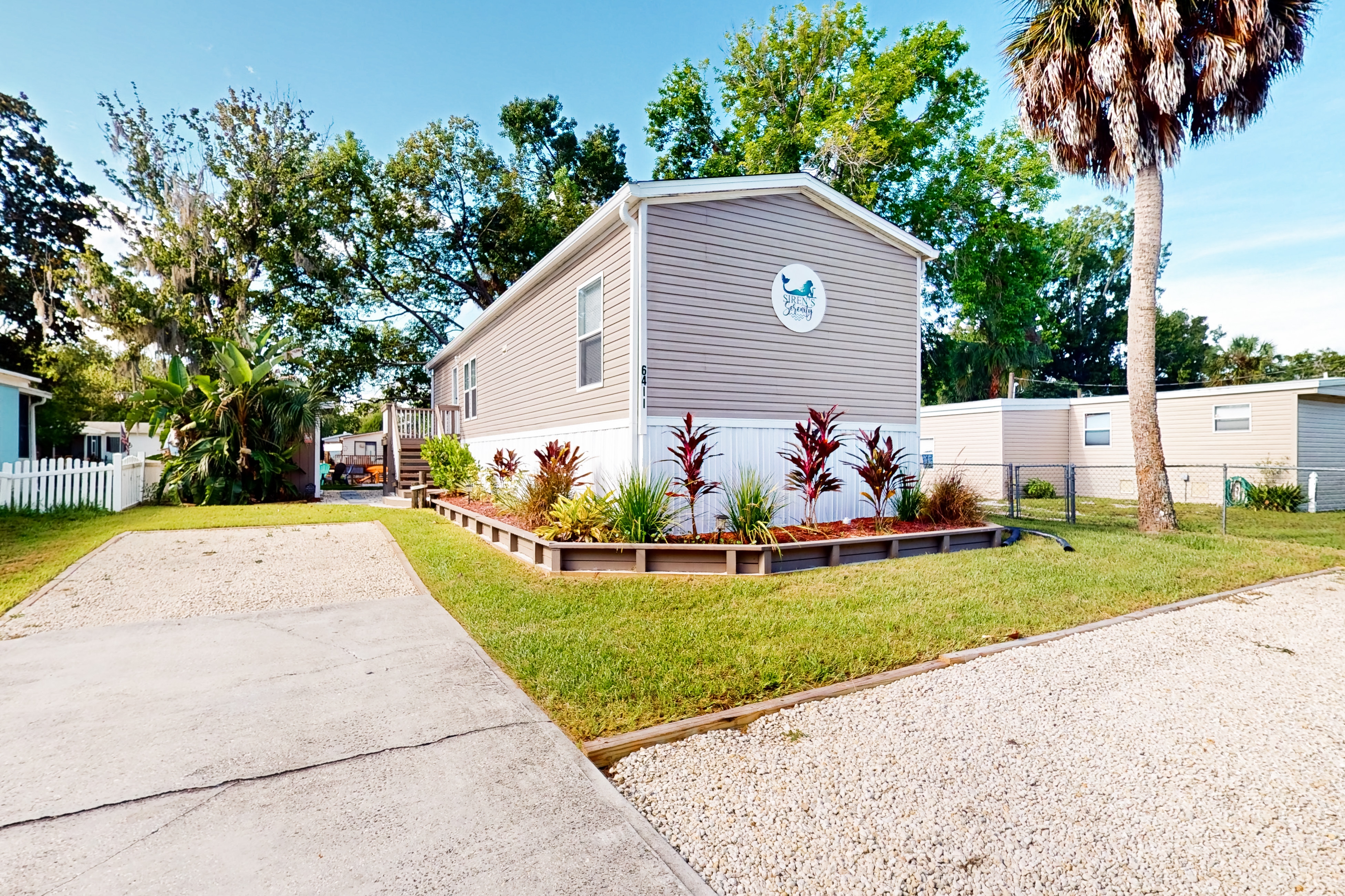 Waterfront home with amazing yard firepit grill putting green AC and WD