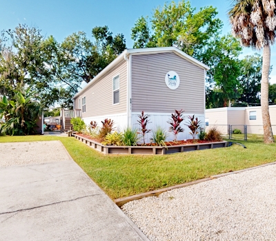 Waterfront home with amazing yard firepit grill putting green AC and WD