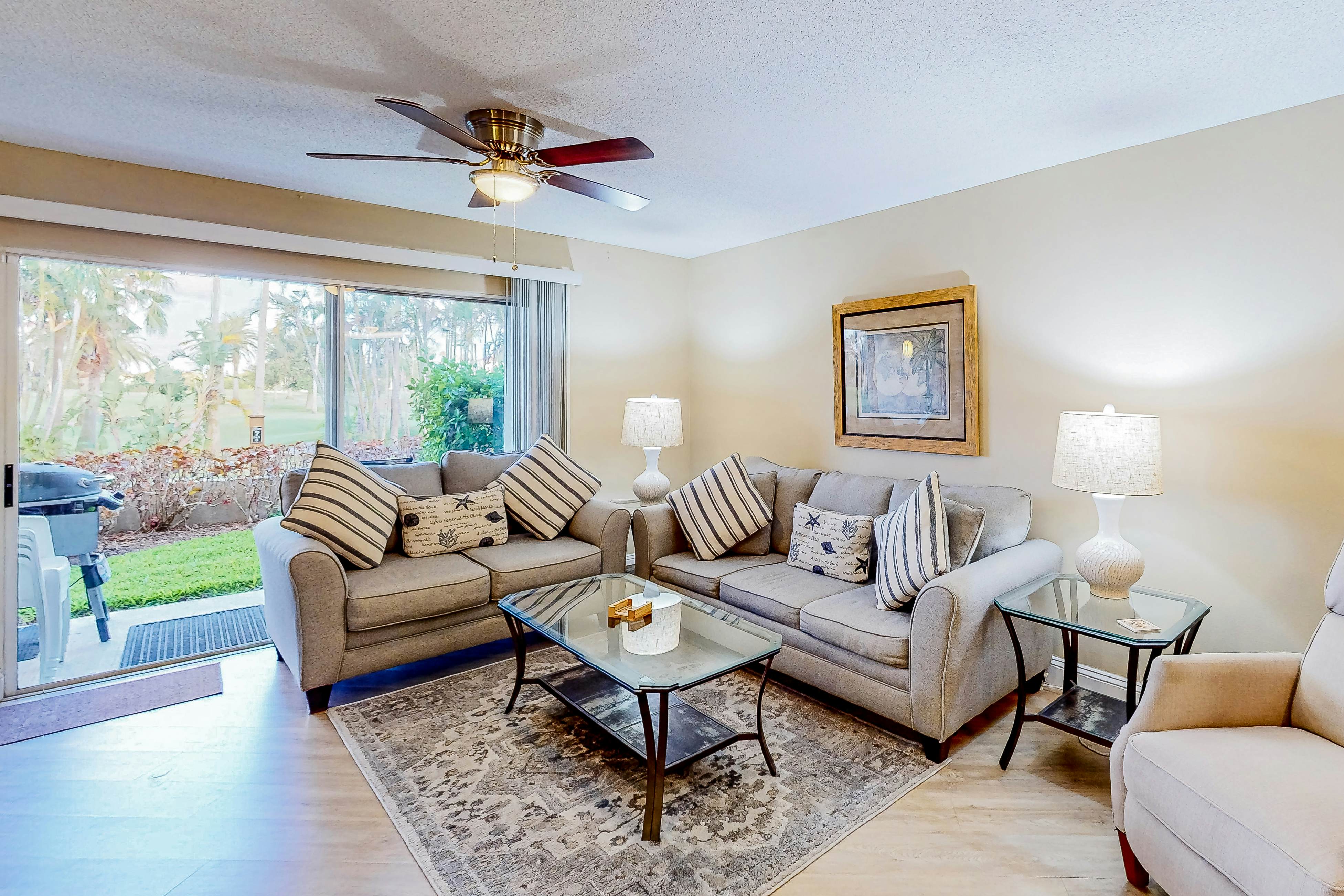 Ground-floor condo with golf course views, pool & beach access