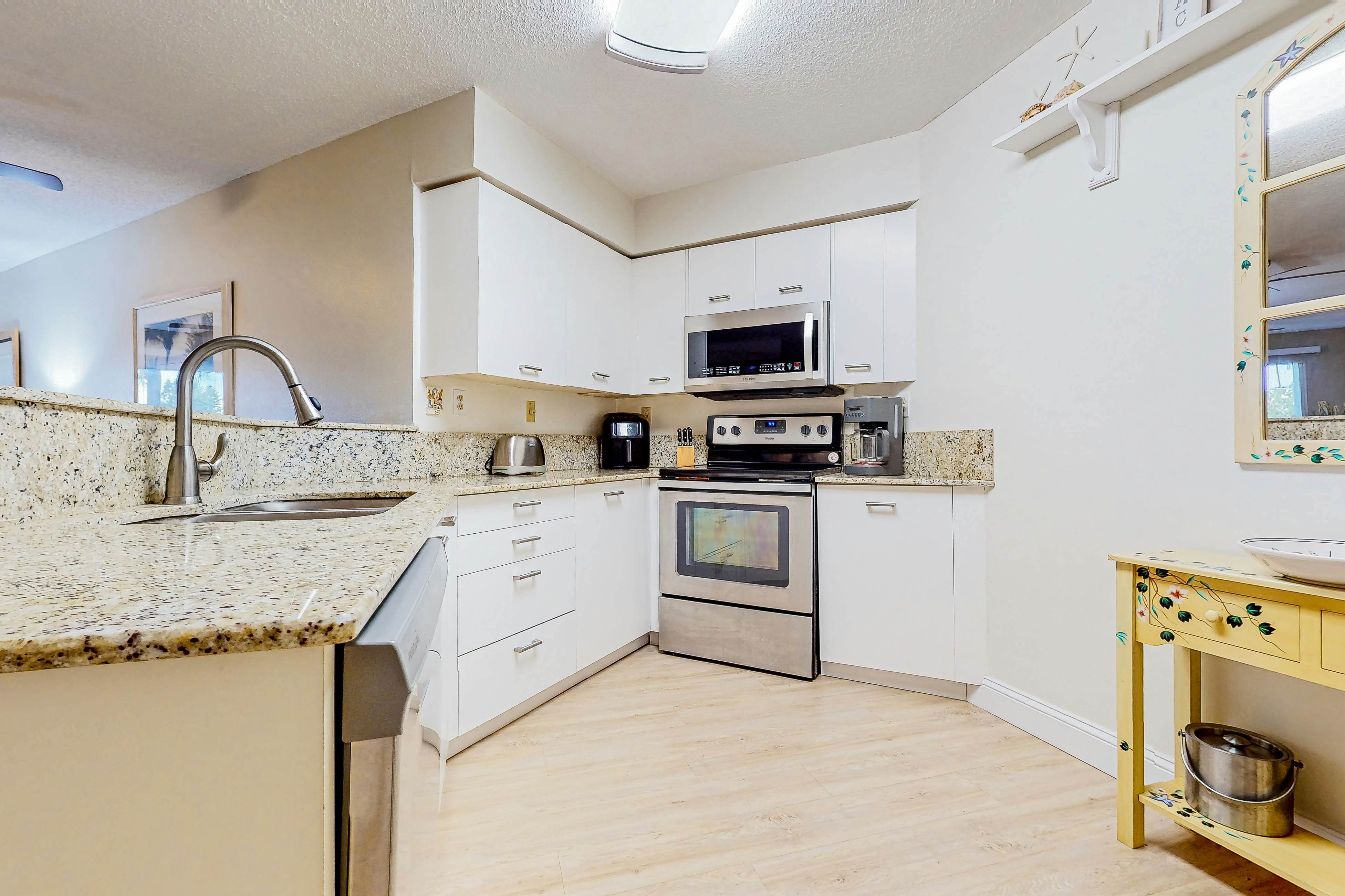 Ground-floor condo with golf course views, pool & beach access