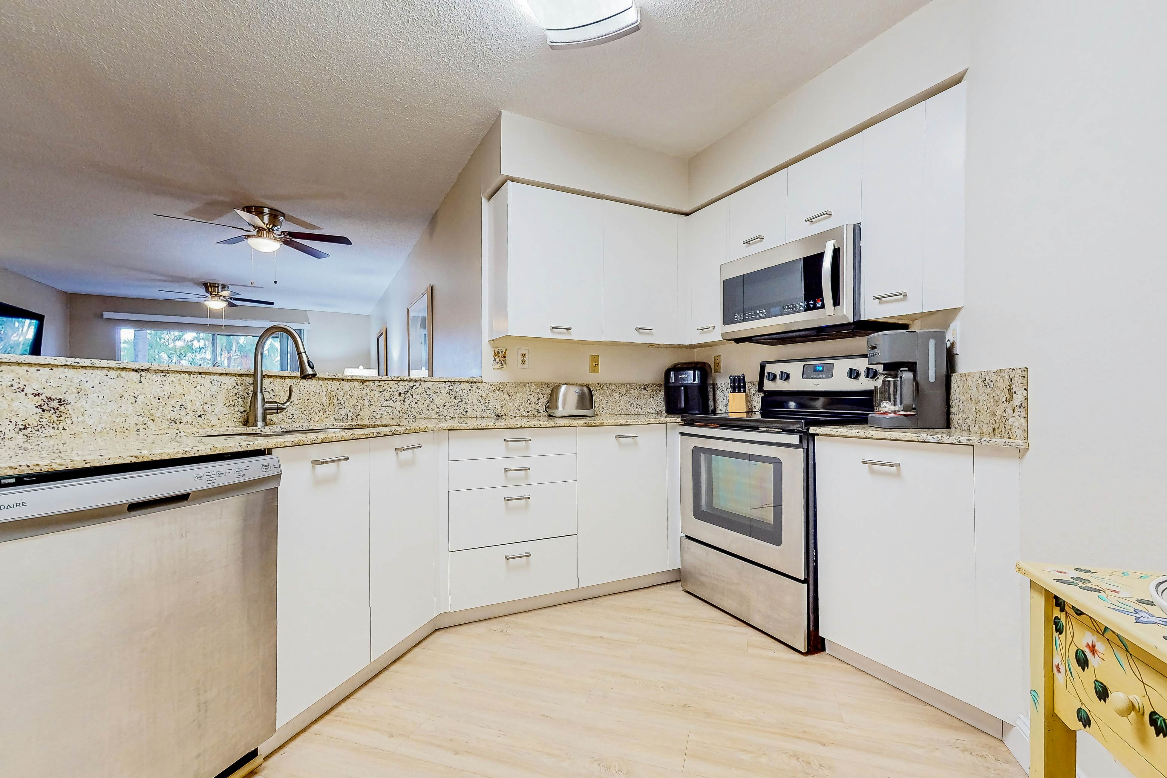 Ground-floor condo with golf course views, pool & beach access