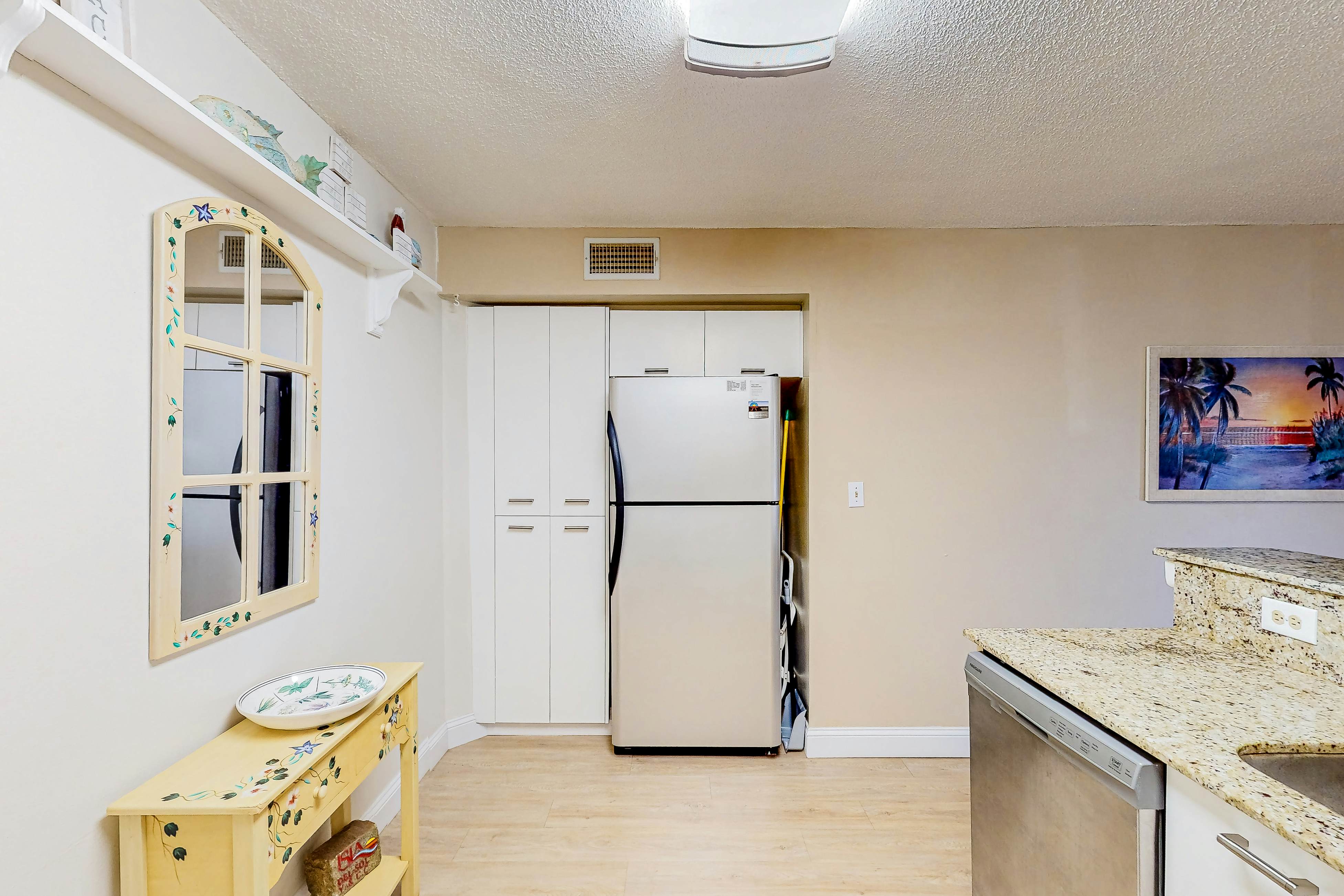 Ground-floor condo with golf course views, pool & beach access