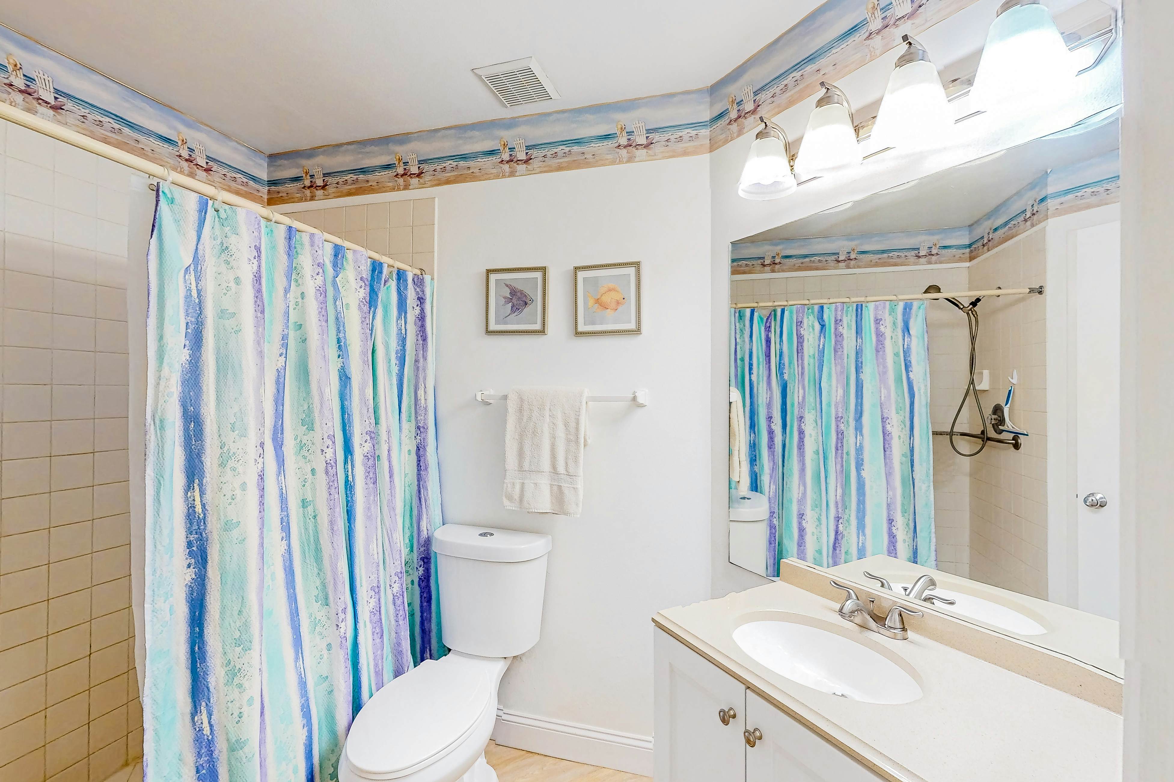 Ground-floor condo with golf course views, pool & beach access