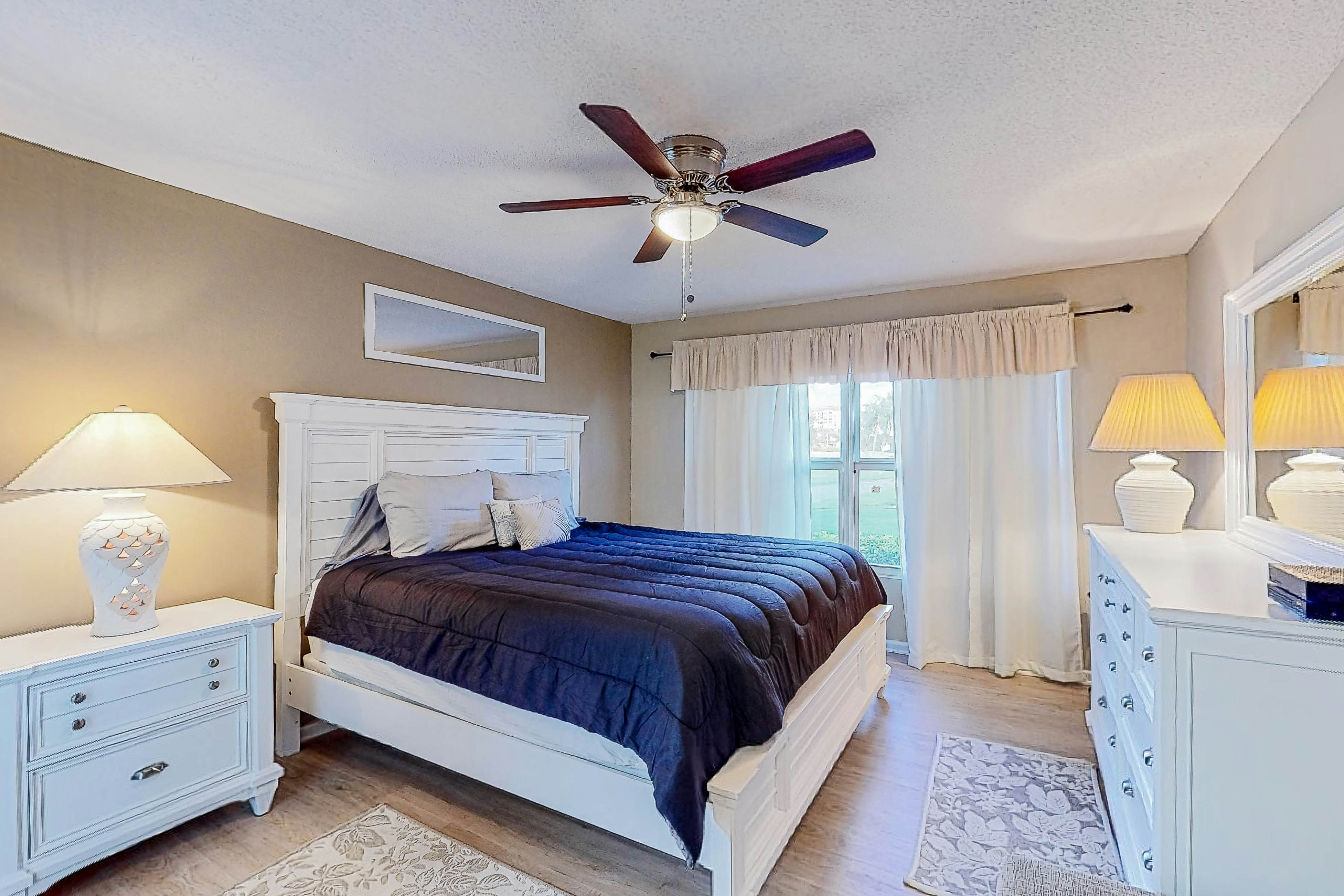 Ground-floor condo with golf course views, pool & beach access