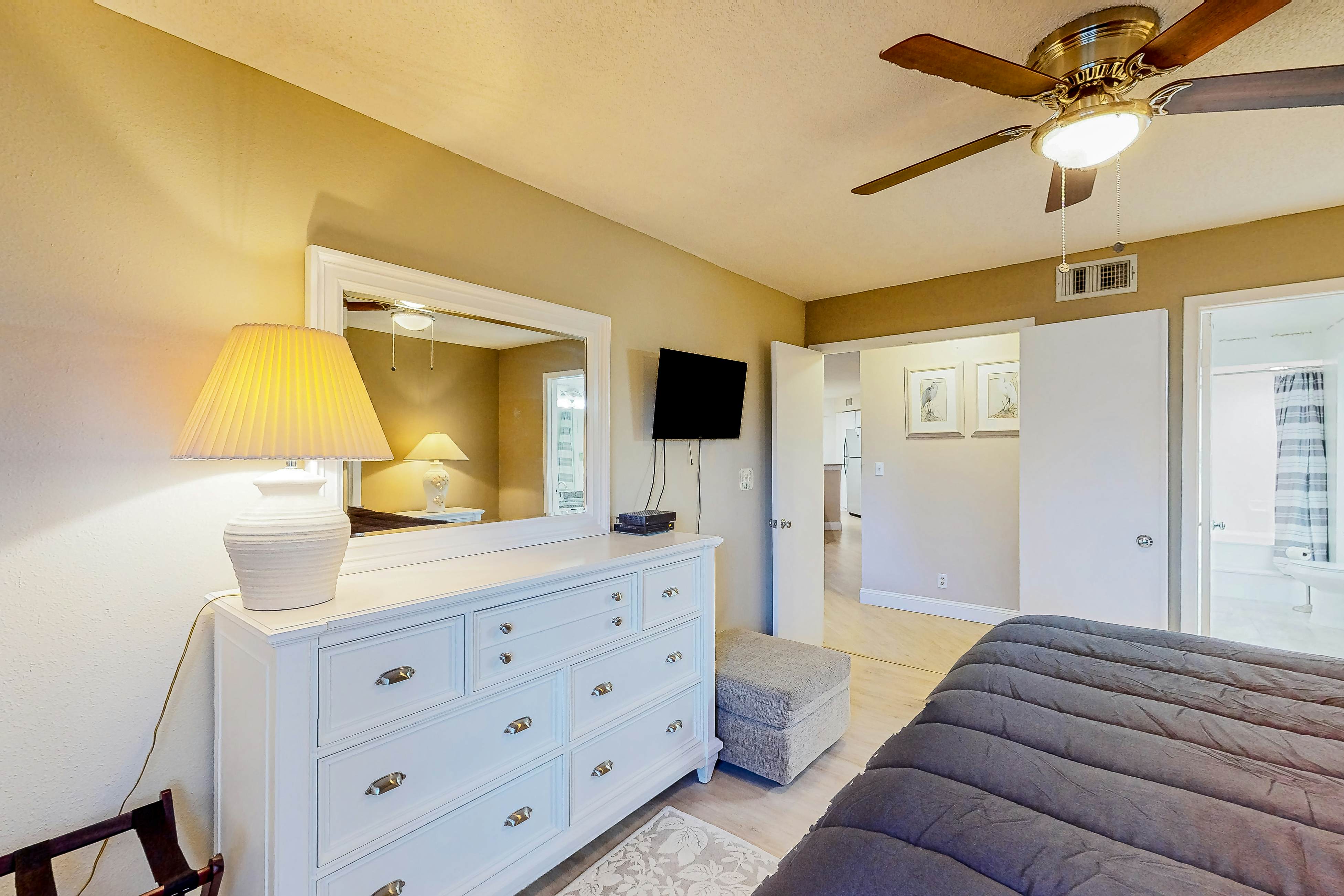 Ground-floor condo with golf course views, pool & beach access