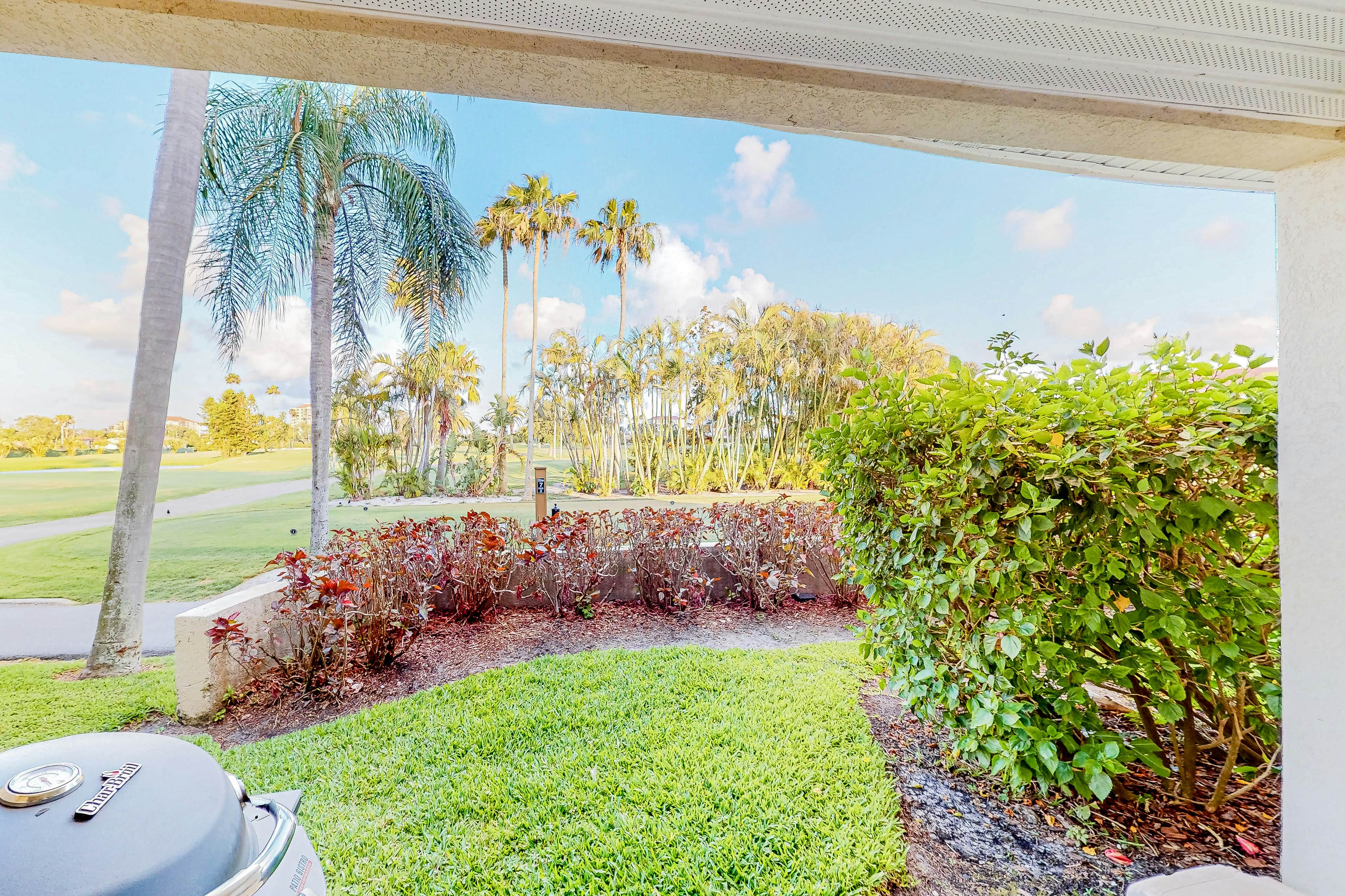 Ground-floor condo with golf course views, pool & beach access
