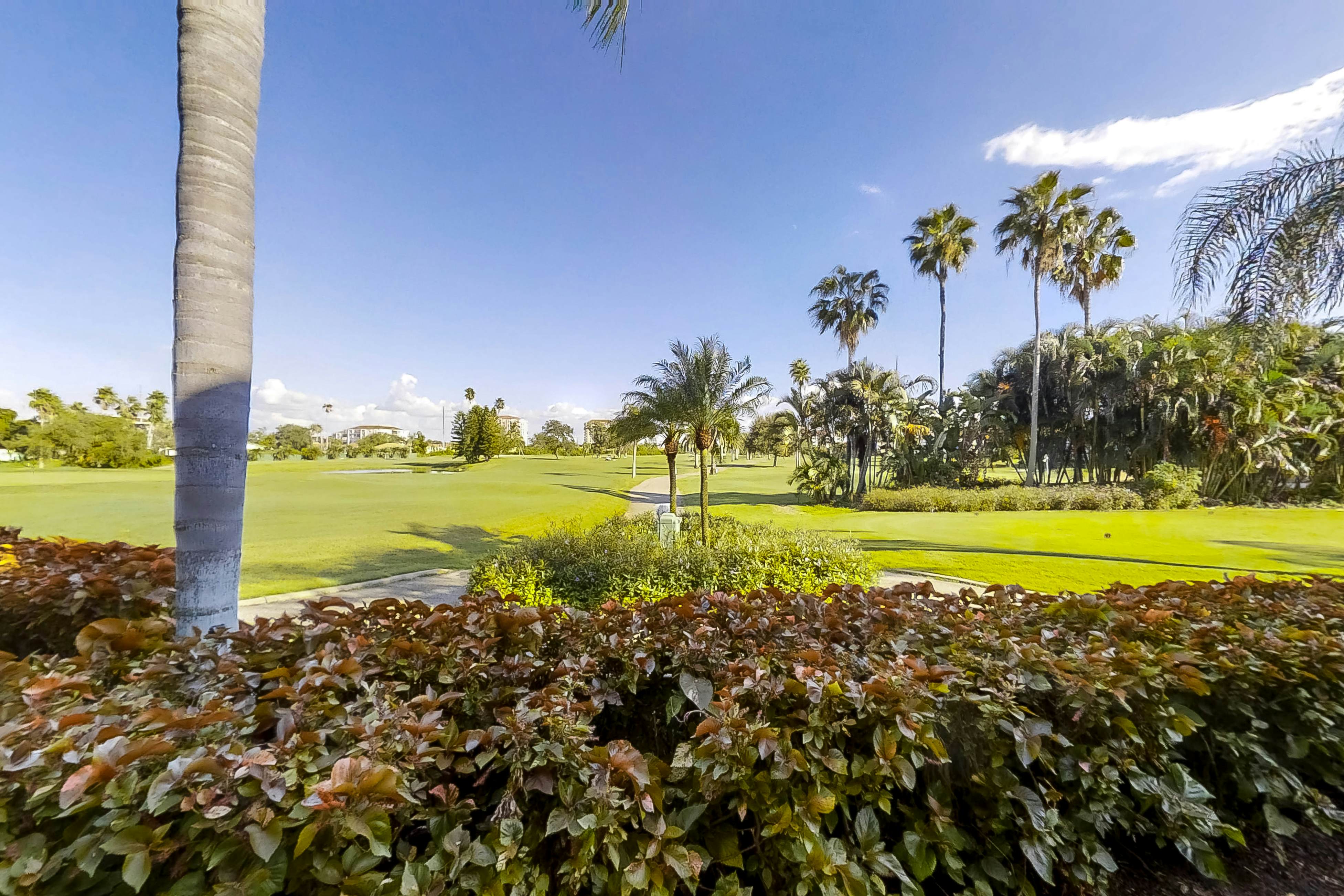 Ground-floor condo with golf course views, pool & beach access