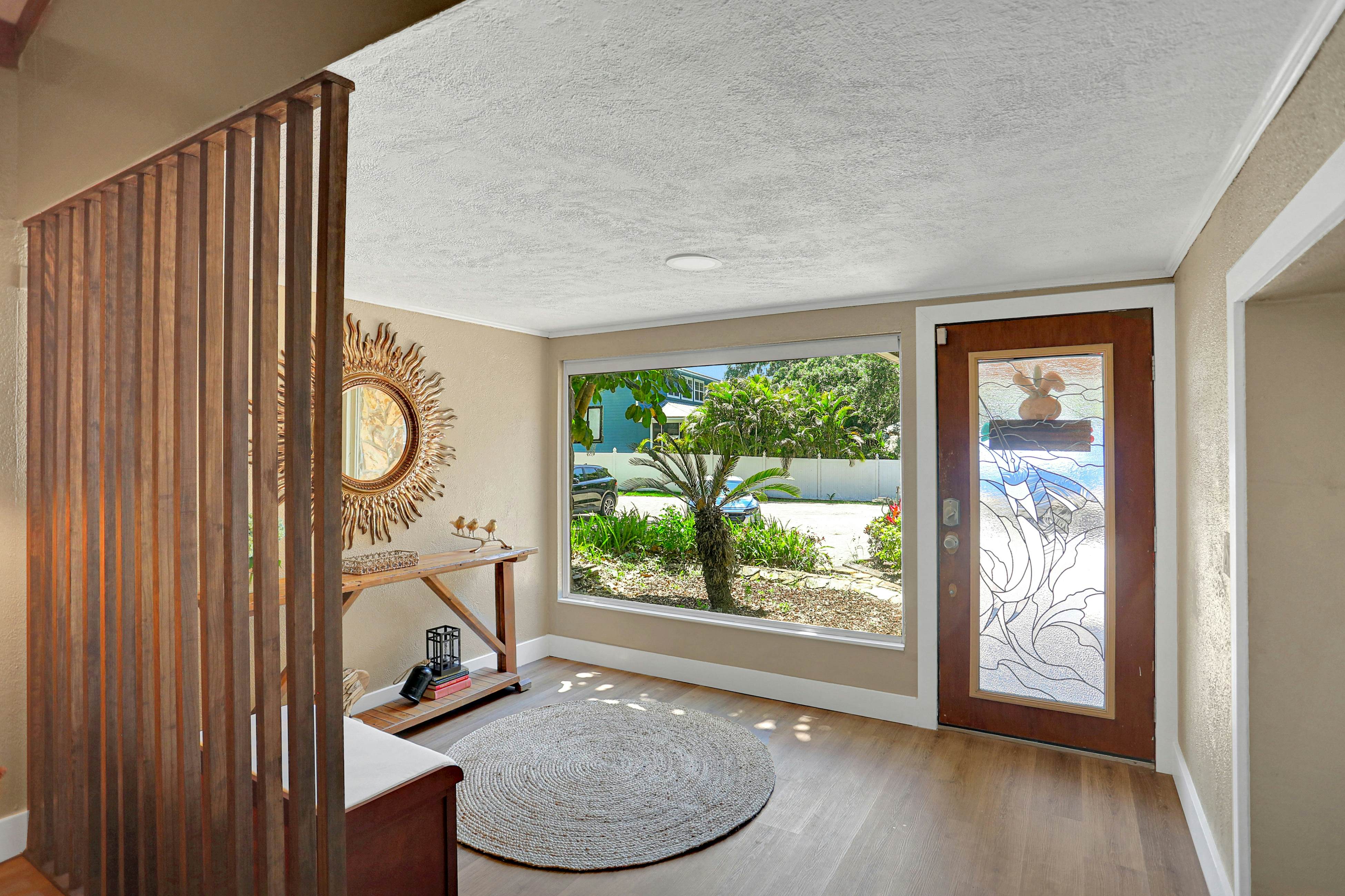 Riverfront retreat with pool/spa, outdoor kitchen, firepit, dock, sauna & games