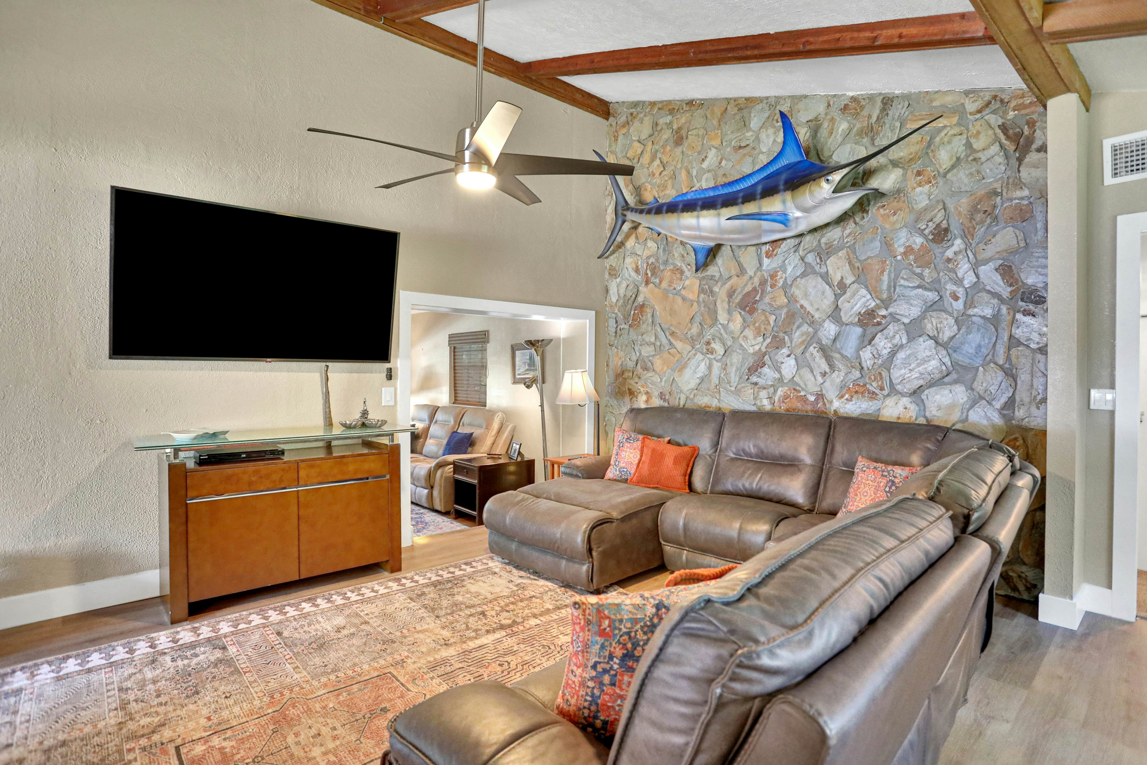 Riverfront retreat with pool/spa, outdoor kitchen, firepit, dock, sauna & games