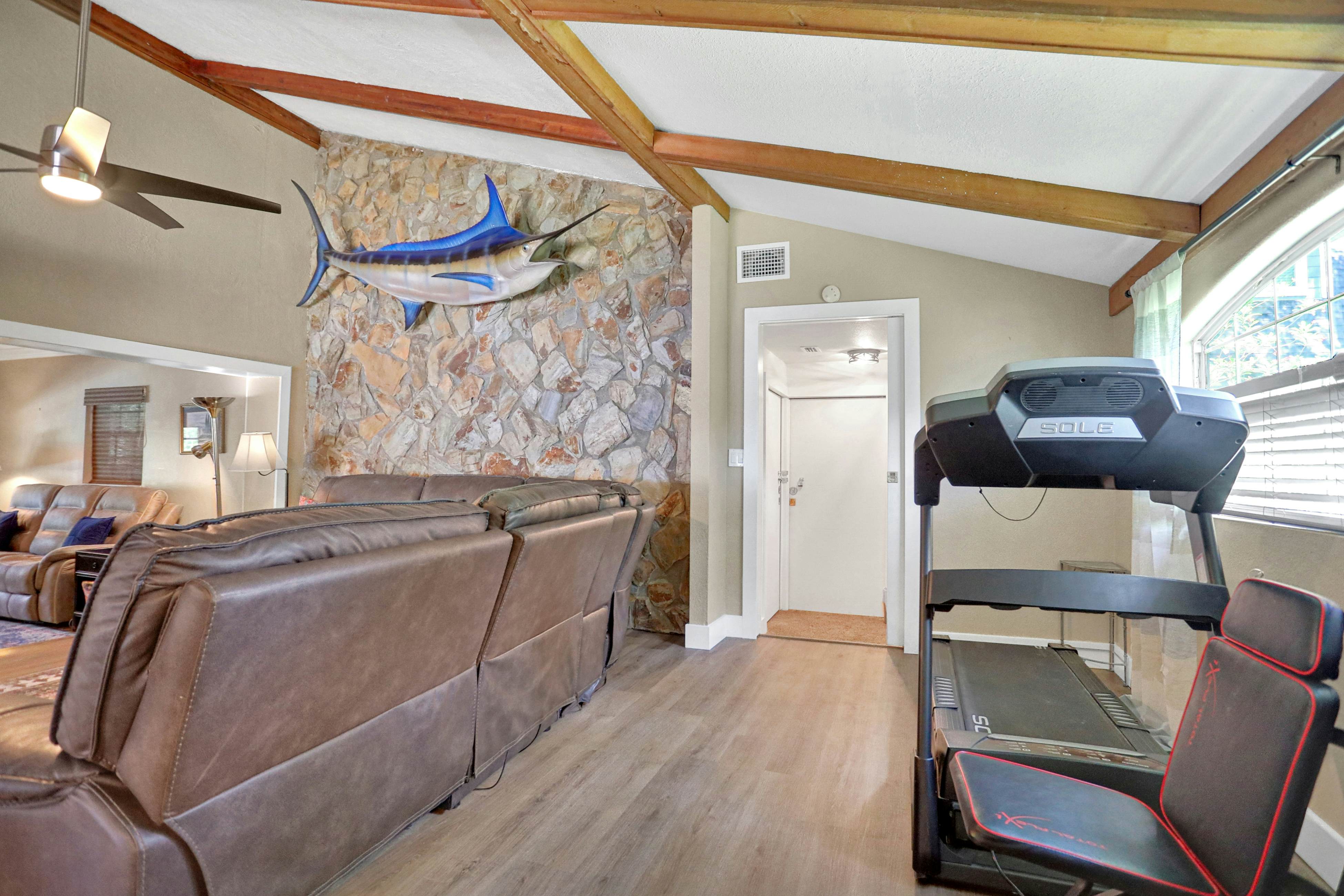 Riverfront retreat with pool/spa, outdoor kitchen, firepit, dock, sauna & games